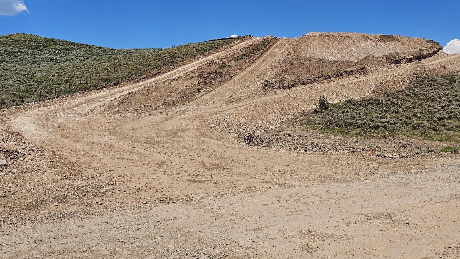 A road was constructed up on top of this hill, and some of its dirt removed to the batch plant site.