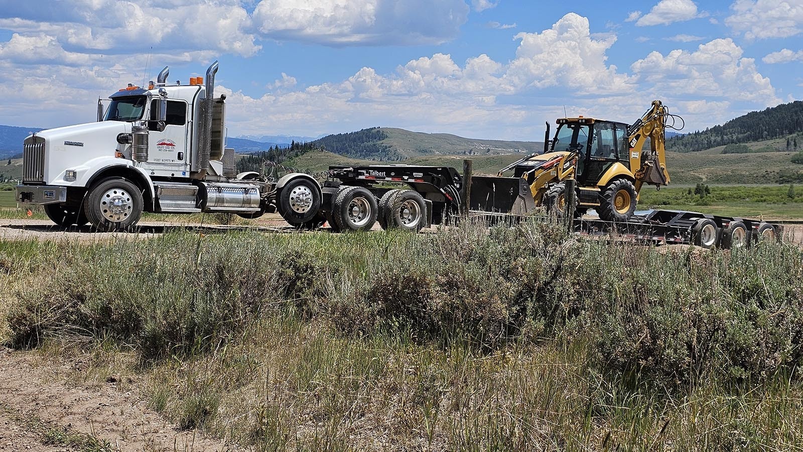 Equipment leaving the site of a 250,000-square-foot resort Joe Ricketts had planned to build in the valley near Bondurant, along the Upper Hoback River Road.