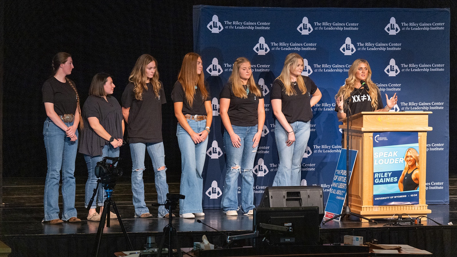 Riley Gaines, right, recognized on stage the six University of Wyoming Kappa Kappa Gamma chapter members who sued over admitting a transgender member.