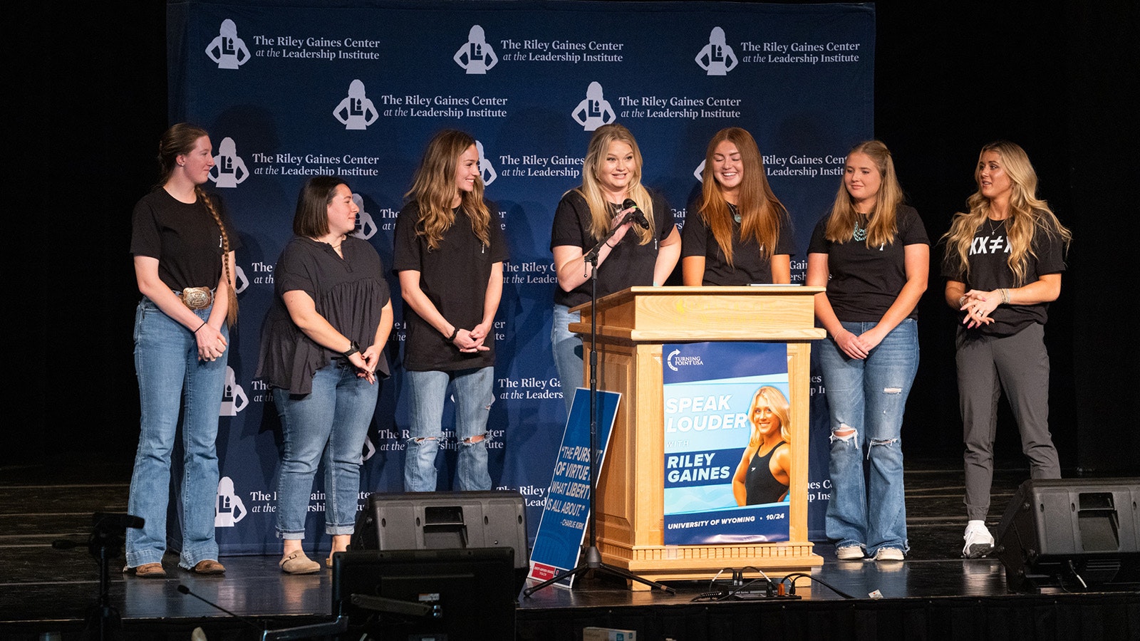 Six University of Wyoming Kappa Kappa Gamma chapter members who sued over admitting a transgender member on stage with Riley Gaines, far right, on Tuesday.
