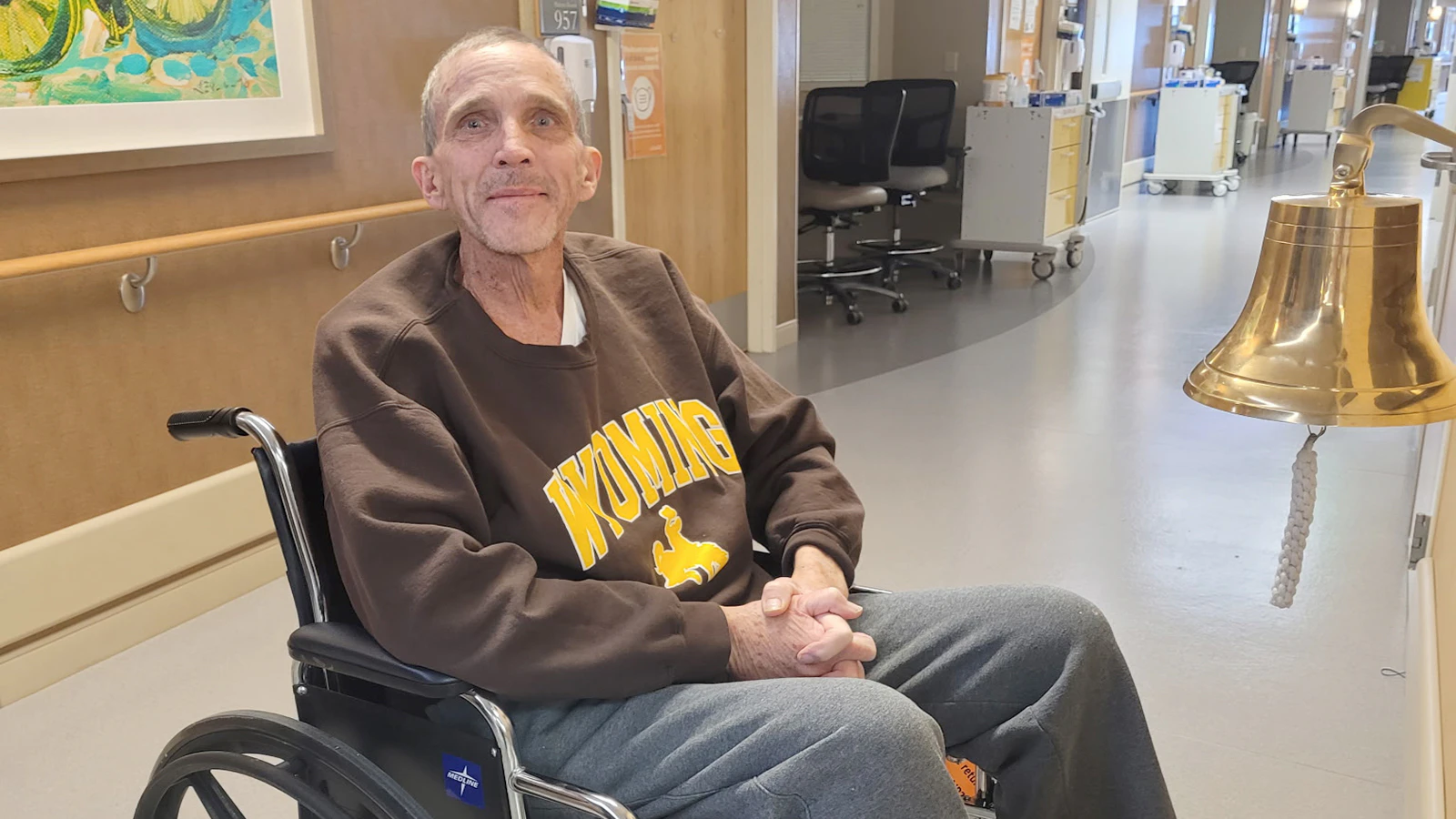 Ken Collamer prepares to ring the bell signifying his discharge from the hospital after his liver transplant.