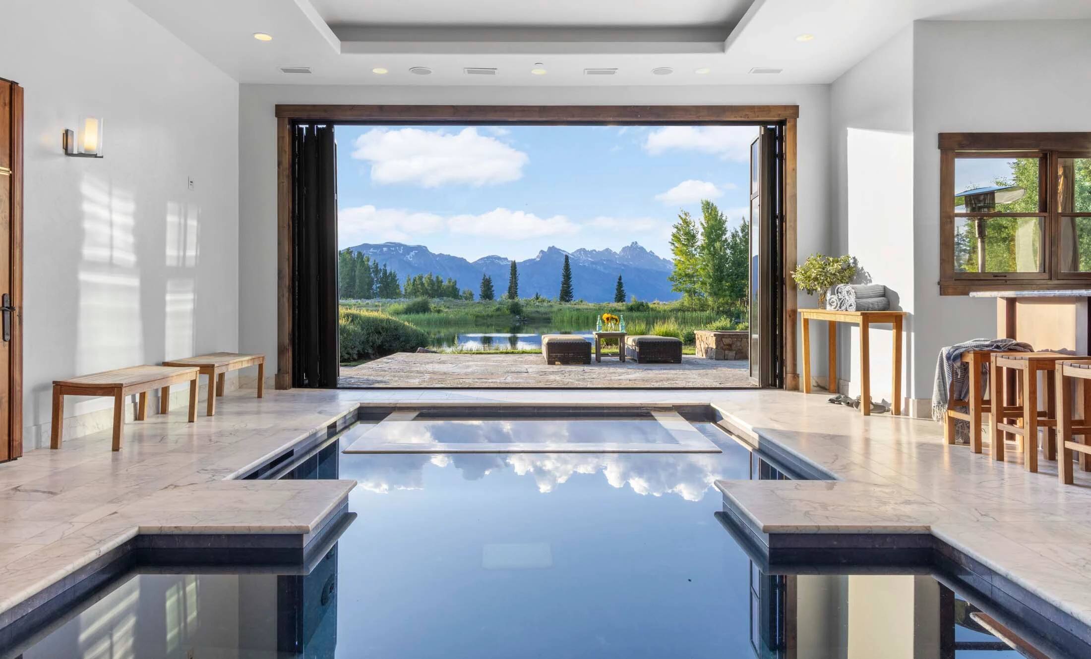 Riva Ridge Reserve, an 18,000-square-foot luxury estate on 117 acres formerly owned by a pharmaceutical executive, has changed hands for close to $39.5M. Its habitable footprint exceeds Teton County size caps, meaning it couldn’t be built today.