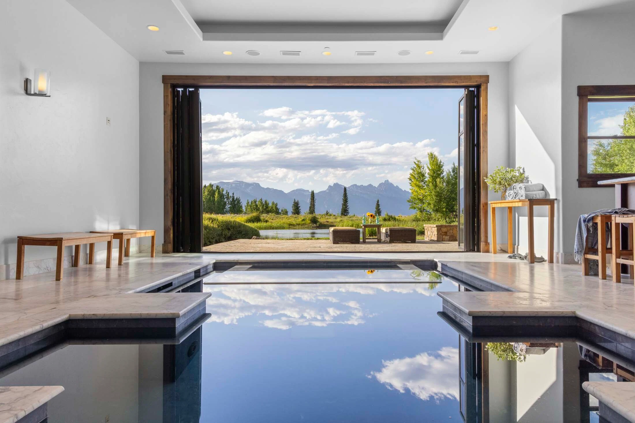 Riva Ridge Reserve, an 18,000-square-foot luxury estate on 117 acres formerly owned by a pharmaceutical executive, has changed hands for close to $39.5M. Its habitable footprint exceeds Teton County size caps, meaning it couldn’t be built today.