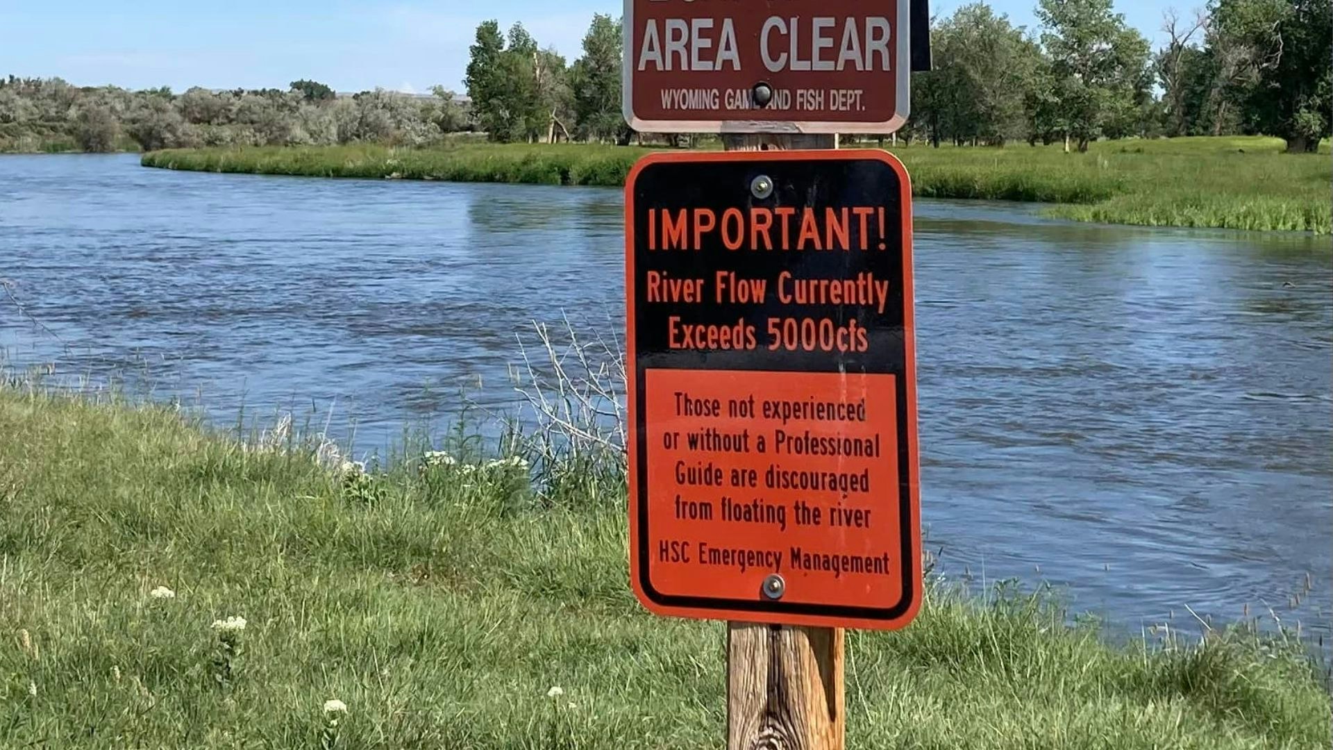 Signs along the Bighorn River warn people about fast and potentially dangerous currents.