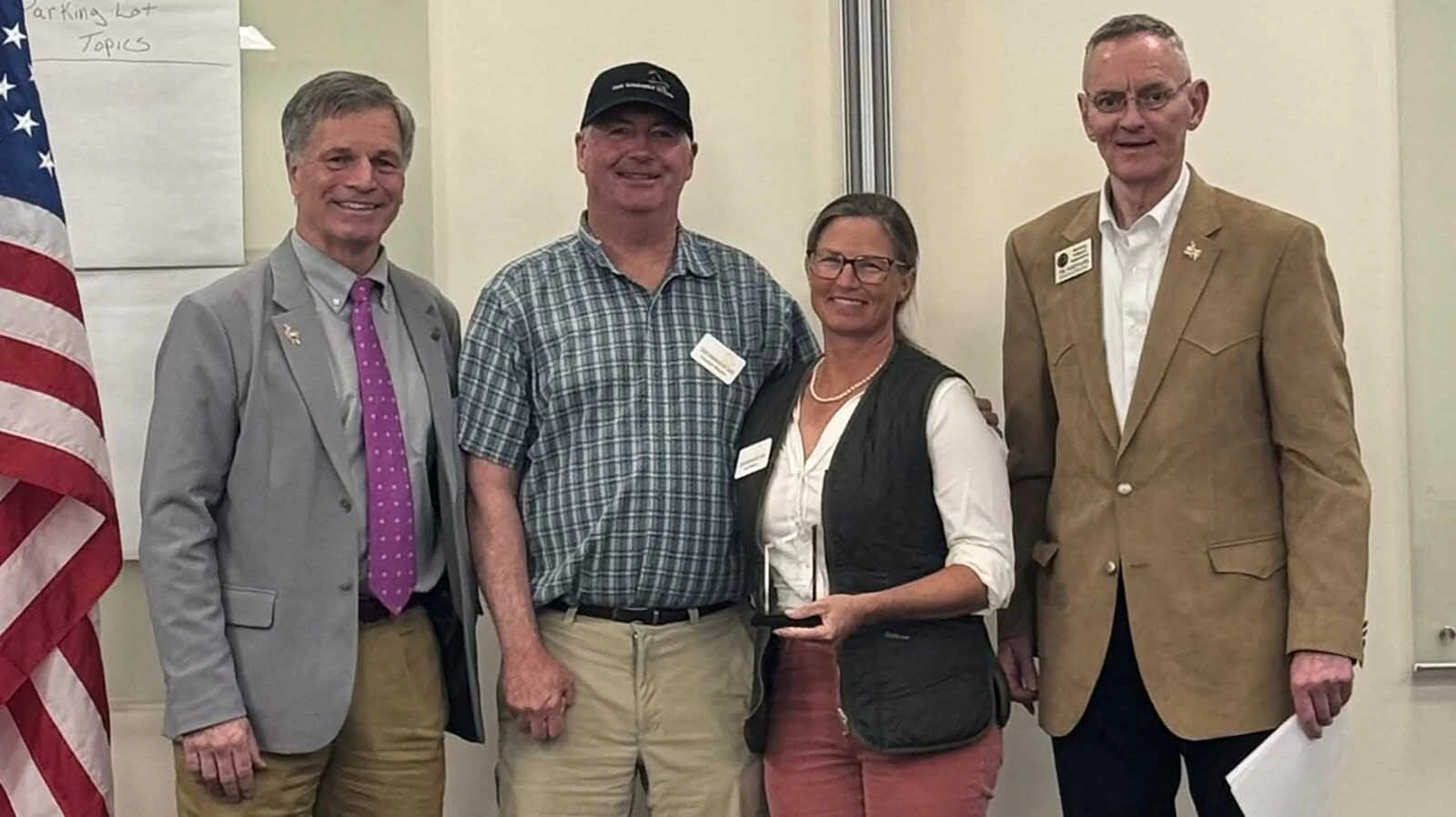 Wyoming Gov. Mark Gordon, from left, Charlie Wilson, Jen Wilson and Col. Tim Sheppard during a recognition of The Soldier’s House in 2025.