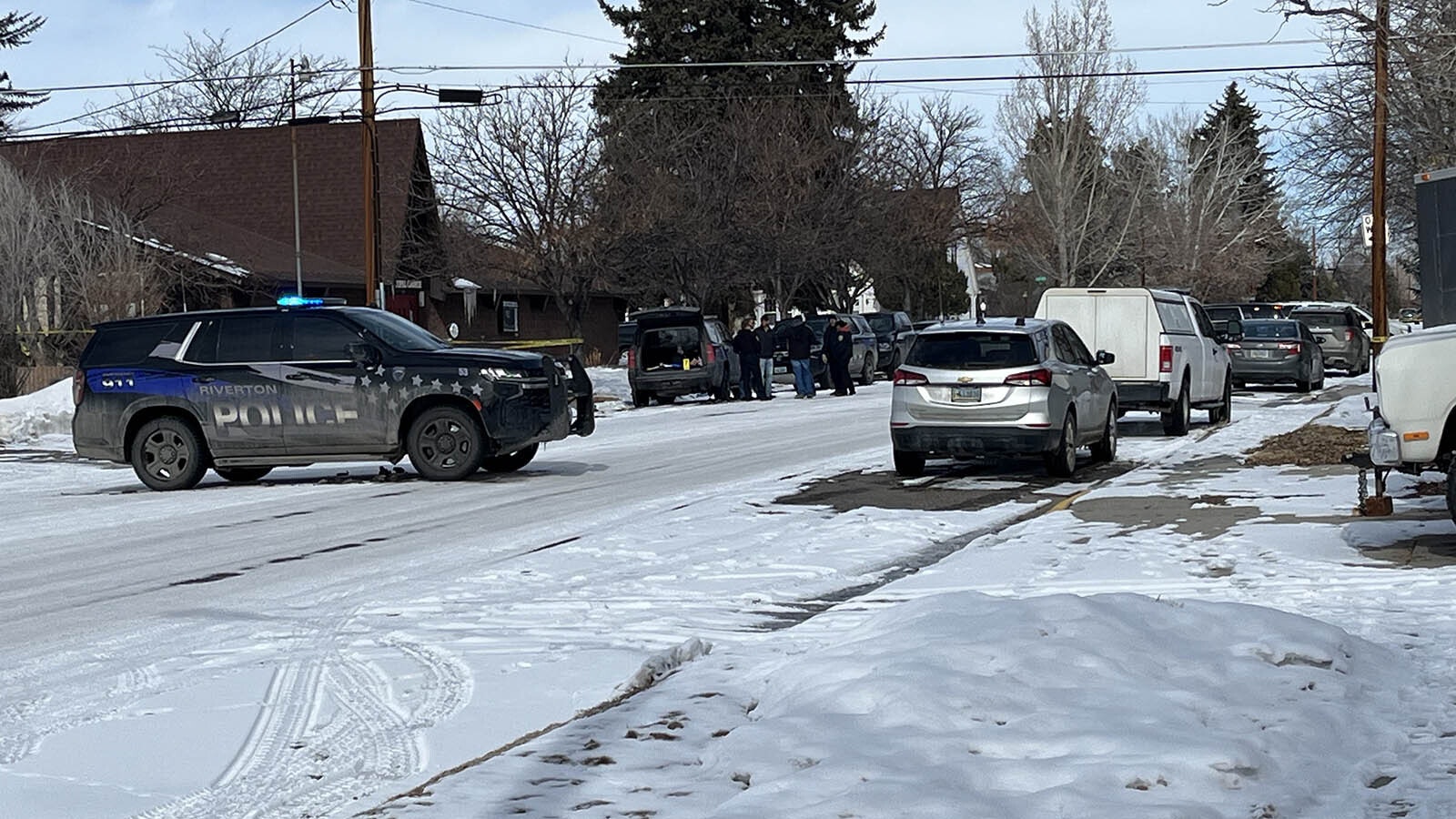 Riverton police and investigators at the scene in February 2024 where the dead body of a man was found near a local church.