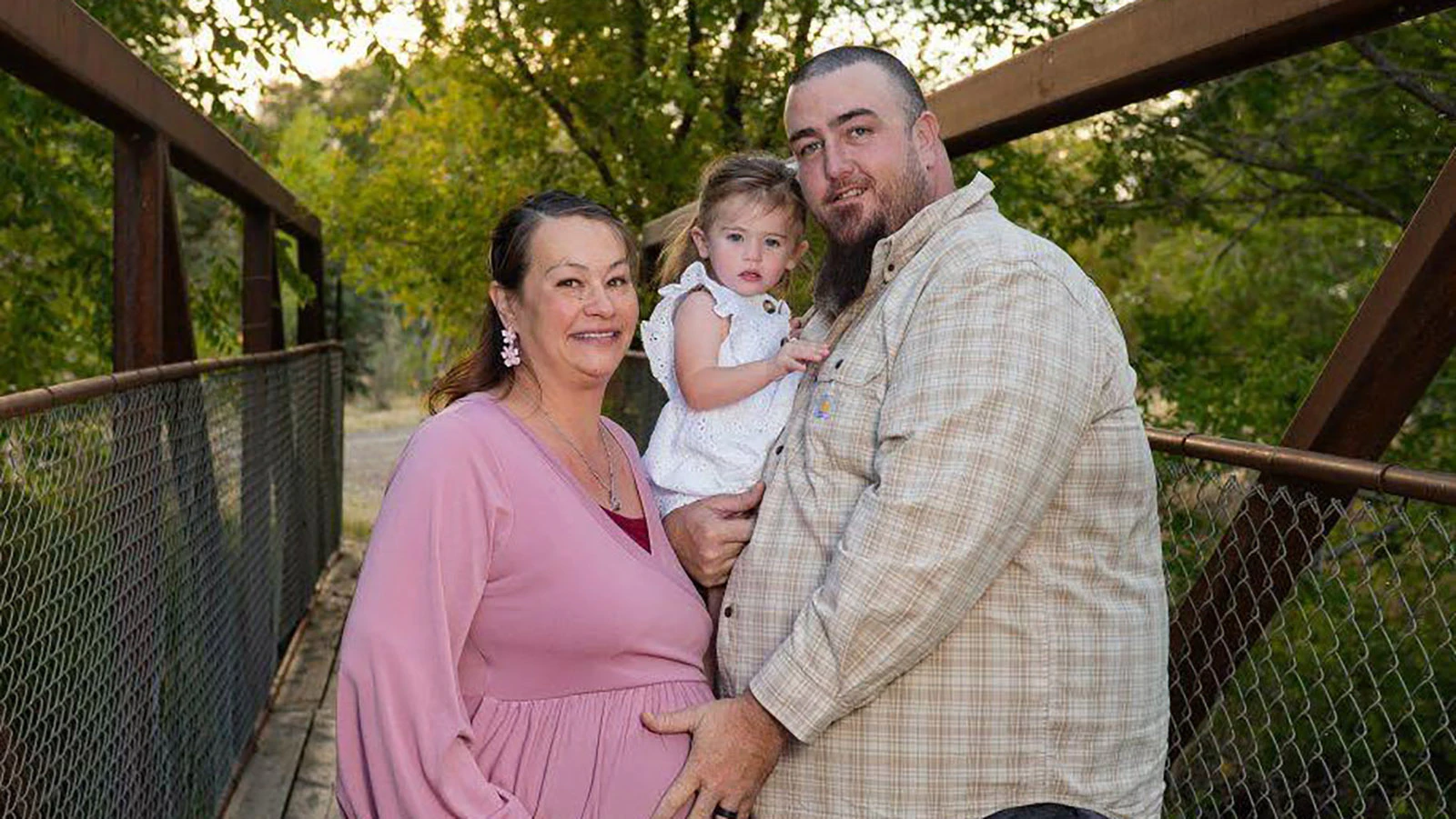Neshako Kay and Robert Saad pose with their daughter. Robert leaves behind his wife and two young daughters.