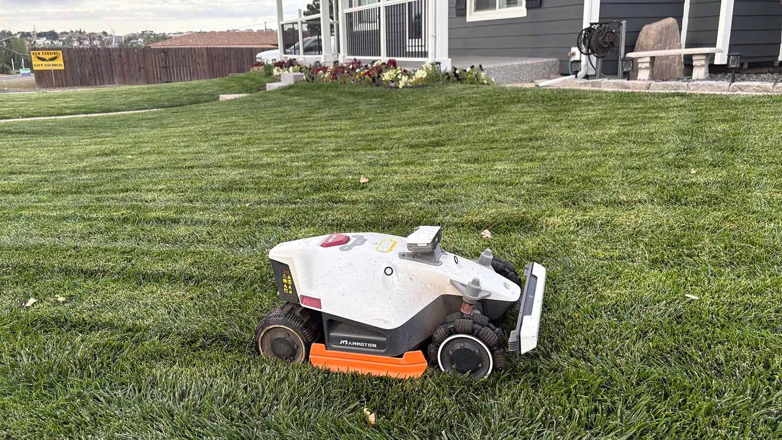 A robot mower cuts Cheyenne resident Shawn Ramsdell's lawn.