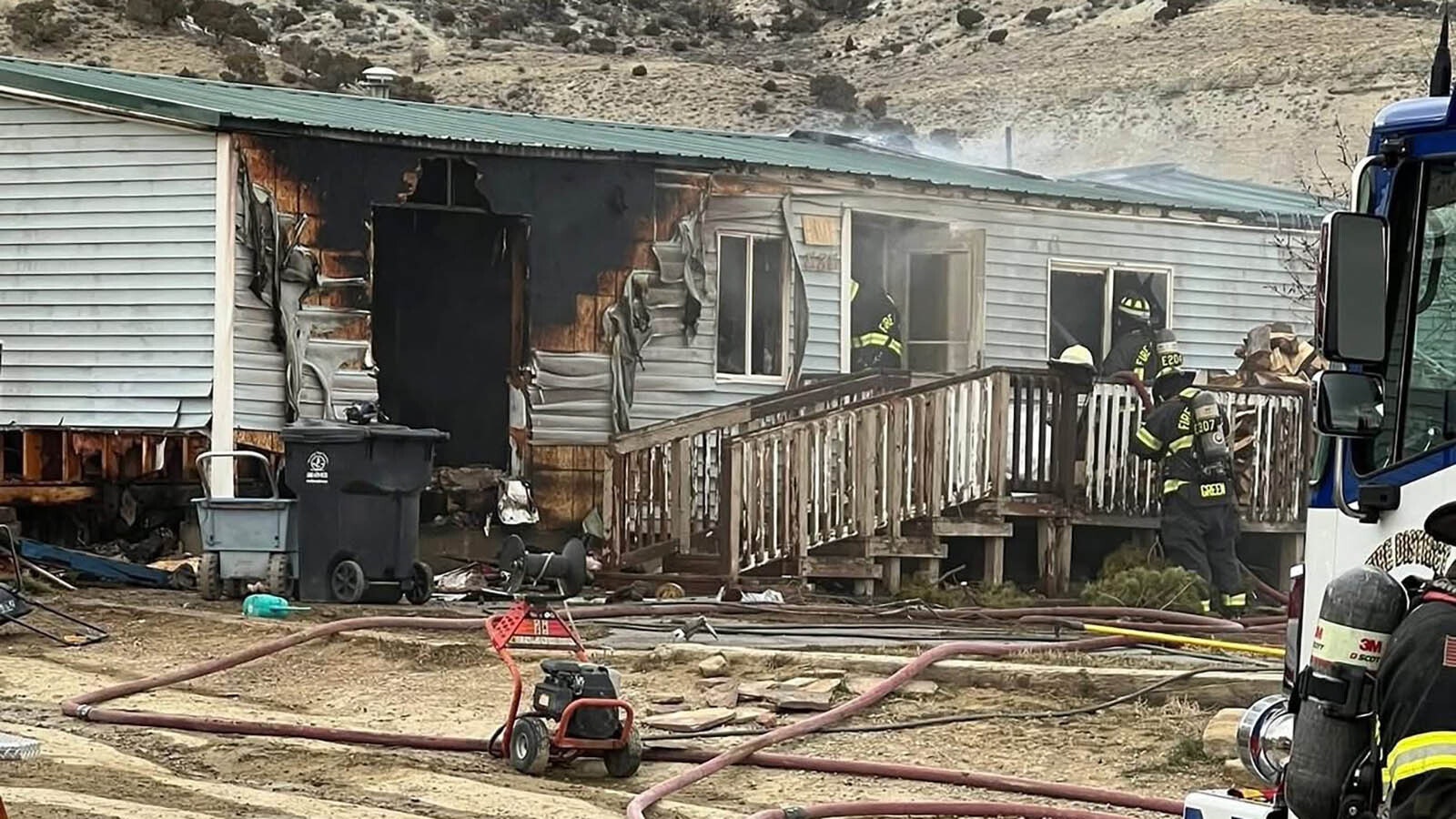 Sweetwater County Fire District No. 1 and Rock Springs firefighters responded to a Rock Springs-area home Tuesday that was filled with smoke and flames fueled by winds. The home was a total loss.