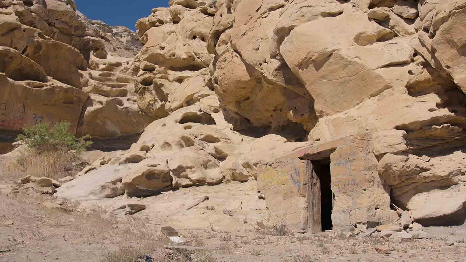 A doorway is seen built into the rock near Veterans Park in Rock Springs, Wyoming. While the mine entrances near I-80 have been filled in, some original infrastructure can still be seen.