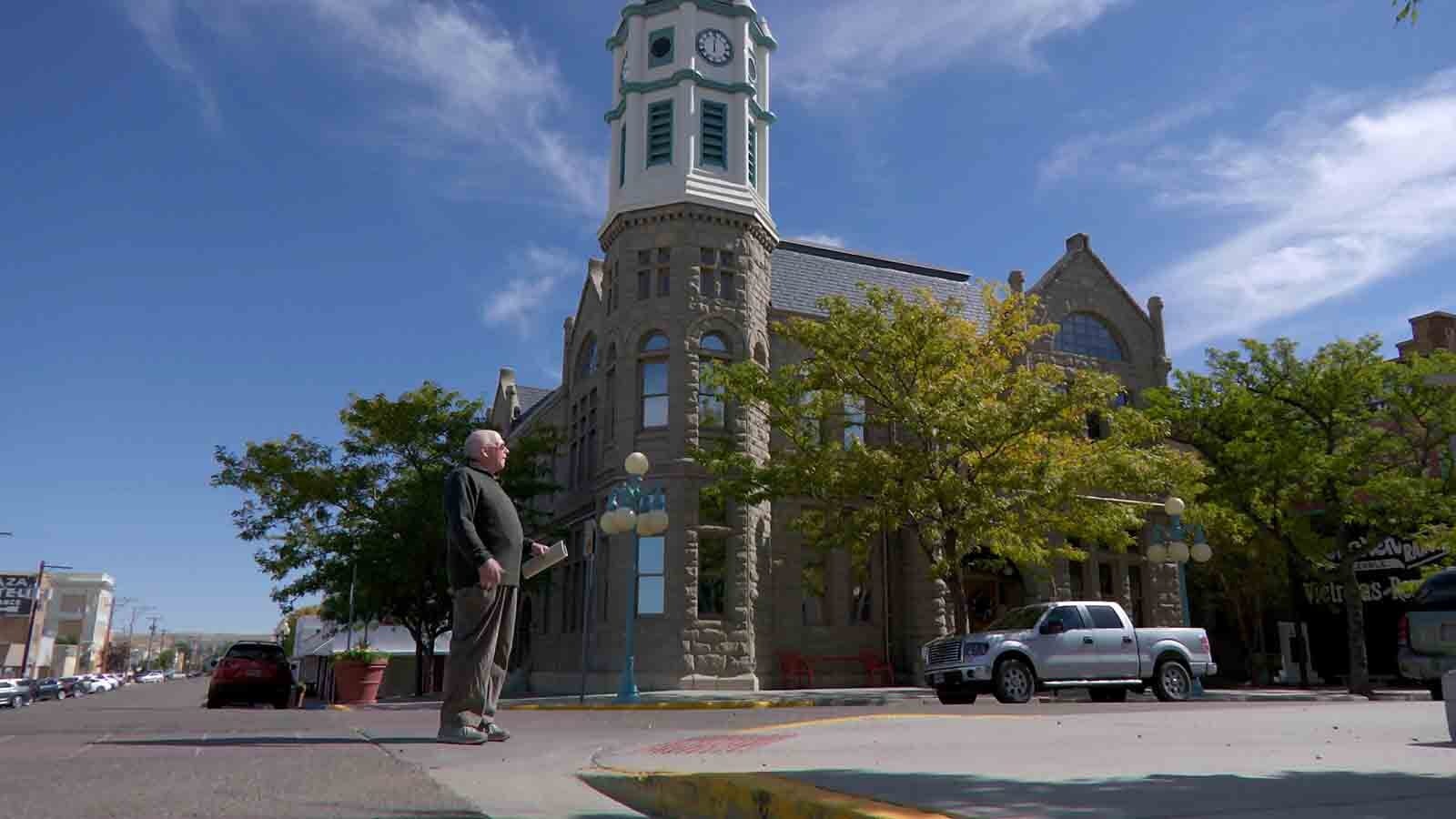 David Johnson stands at the site where a subsidence hole opened up overnight in 1988 just outside city hall. Rock Springs was able to repair the structure using money from the Abandoned Mine Lands division, and the building now serves as the local historical museum.