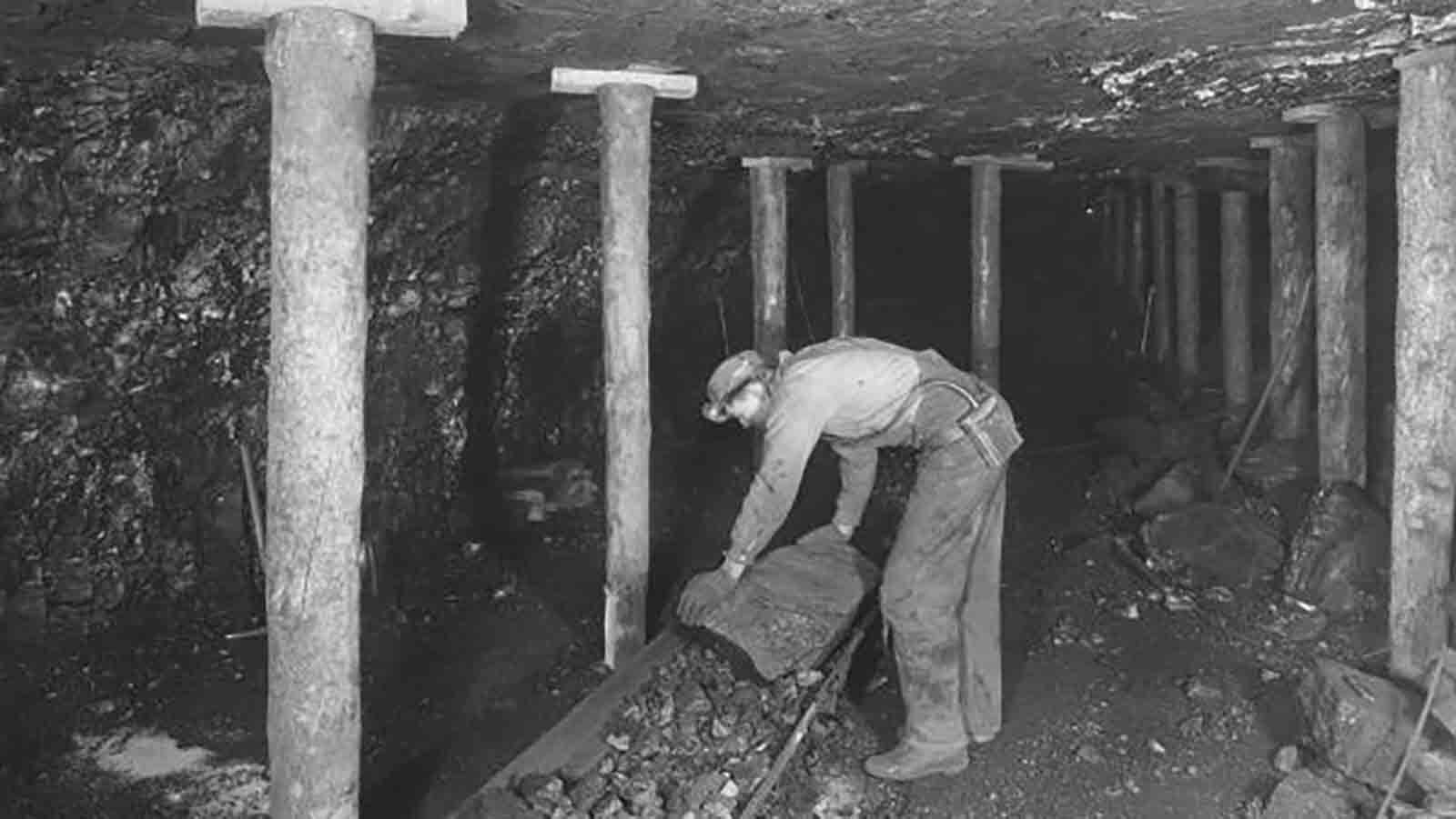 A worker can be seen in Rock Springs’ No. 8 mine loading coal onto a conveyor belt system, date unknown.