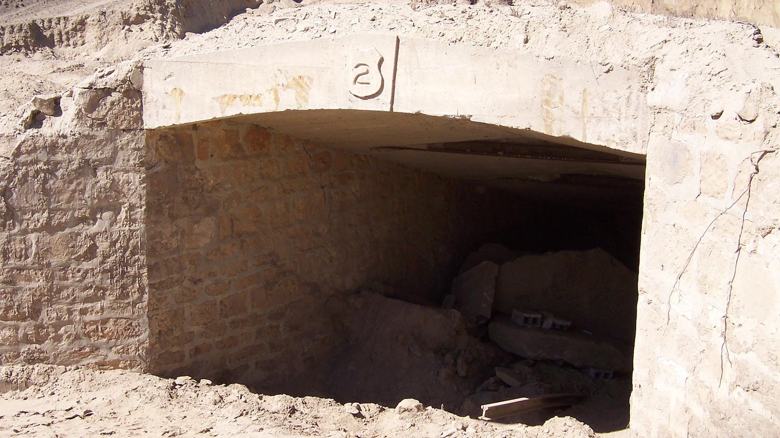 A portal to the Lionkol / E-Plane Mine between Rock Springs and Reliance is pictured during survey work on the site in 2007. Sites like these are first surveyed for historical artifacts, then secured using various techniques to ensure stability of the underground structure.