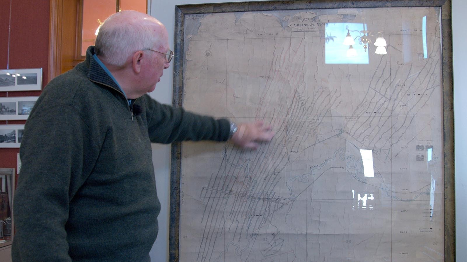 Historical Archaeologist David Johnson explains a map that shows the extent of coal mining tunnels in Rock Springs inside the Rock Springs Historical Museum.