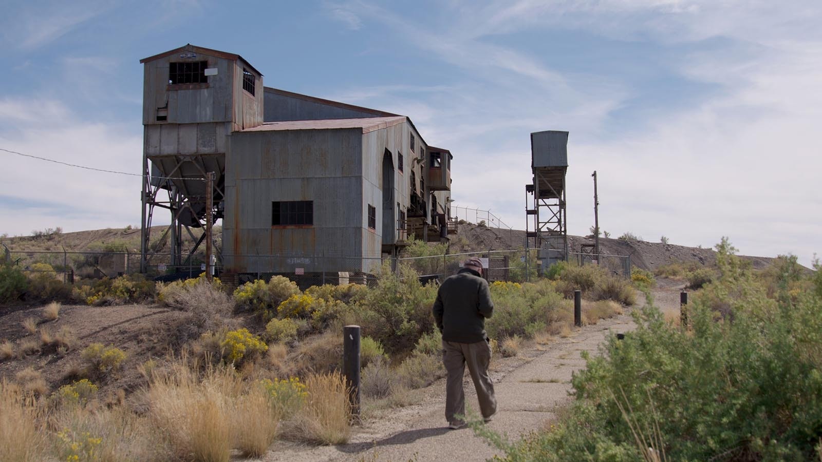 David Johnson approaches the Reliance coal tipple, a preserved example of coal mining infrastructure just outside Rock Springs. Dave gives tours of the site to visitors.