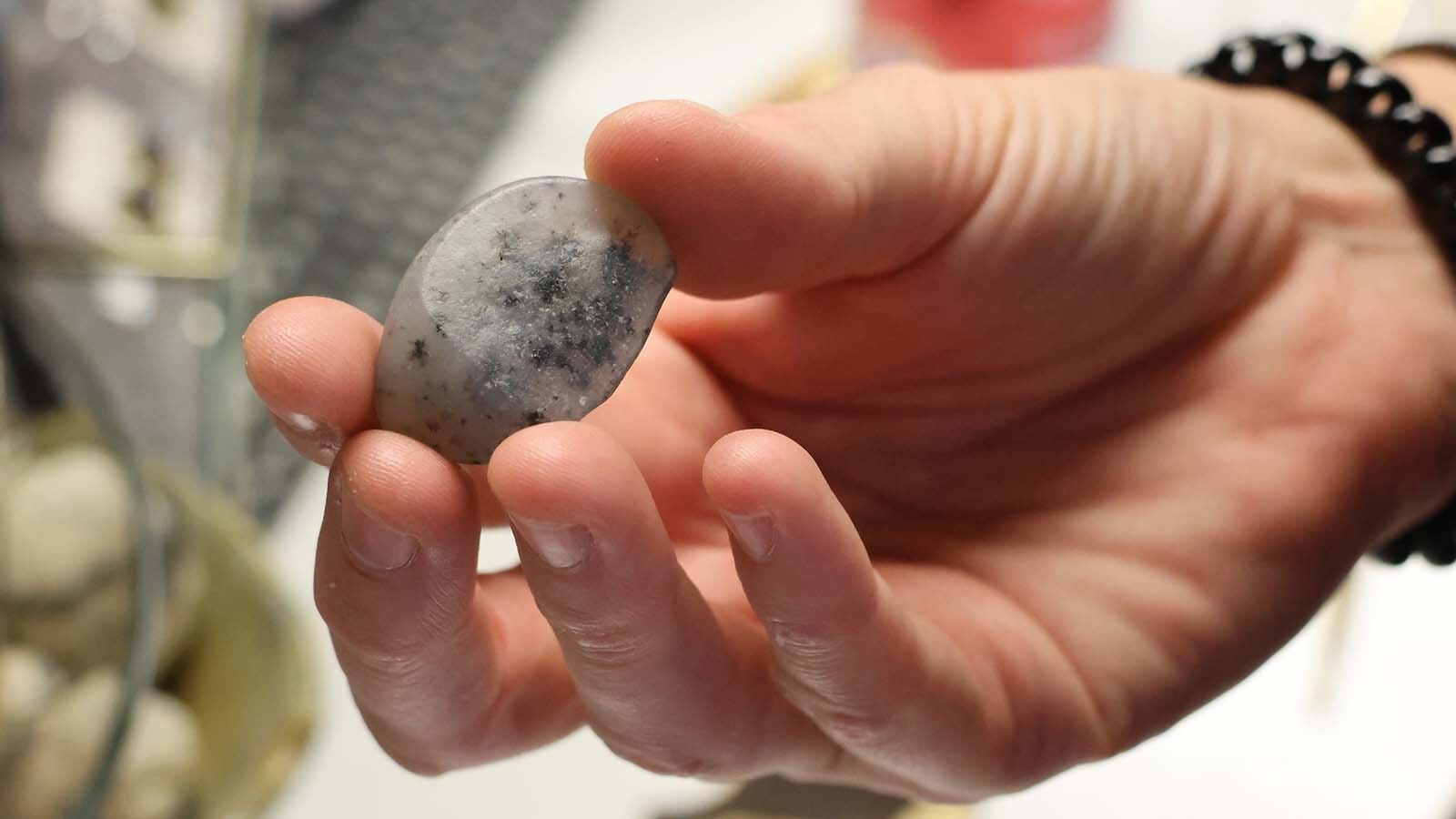 Rachel Hawkinson holds a blue opal agate that she found in the Shirley Basin.