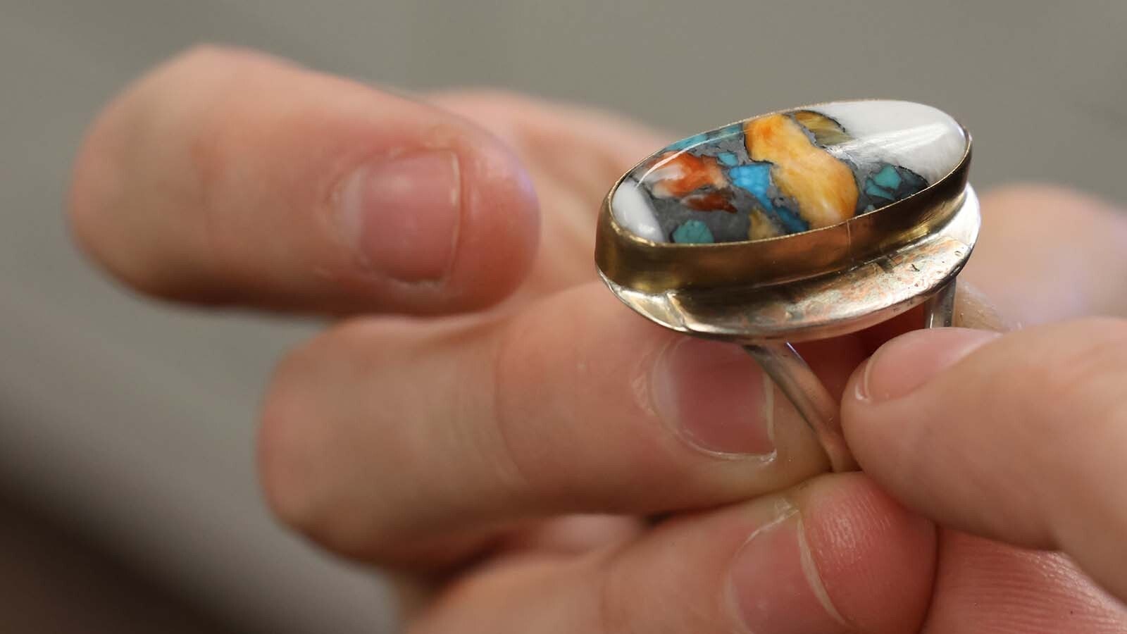 A ring that features layers of metal used for its base.