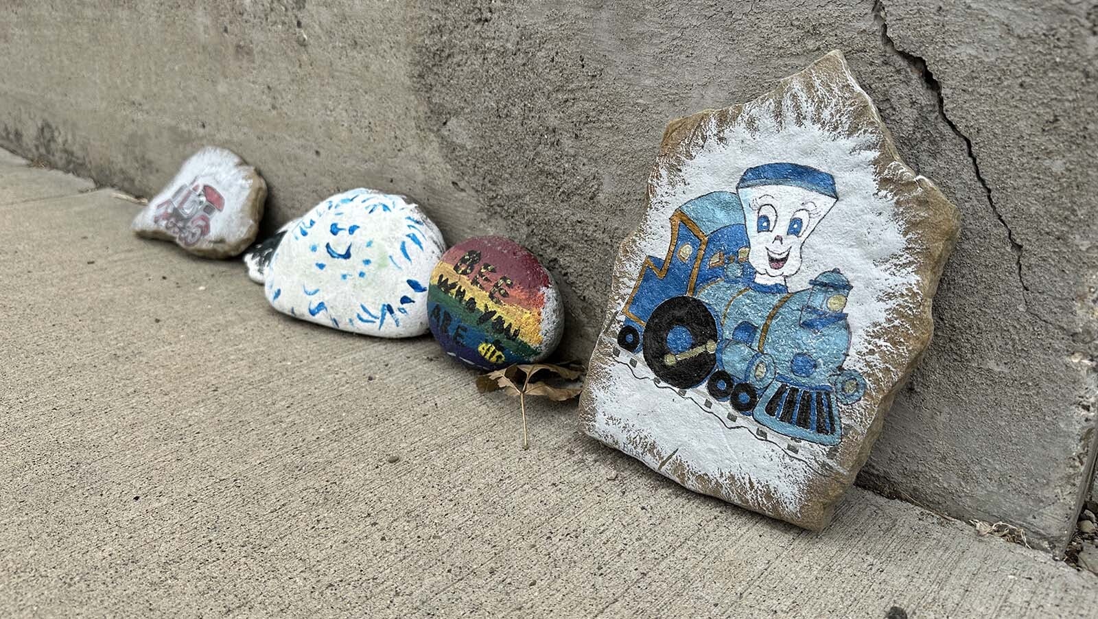 Jake the Train in Cody. Like many painted rock displays, the size changes all the time as rocks are added or taken away. So long as something is leading the way, a painted rock can be added to the line or end up in a pocket or in someone's home as a personal memento.