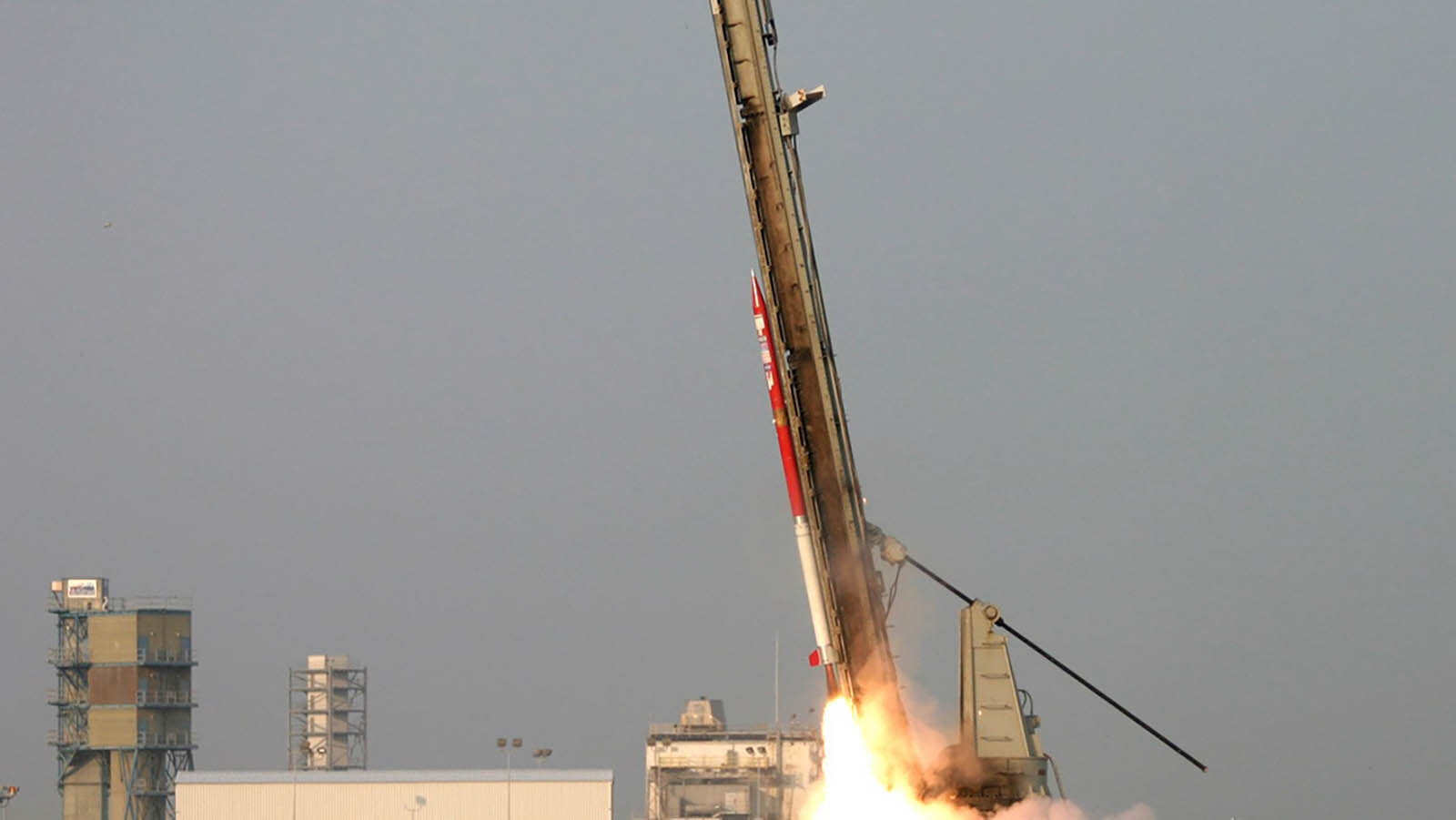 The launch of a Pathfinder rocket at NASA Wallops in 2004. This was the first rocket launched by NASA that was designed and built by students. Casper College designed and built the solid rocket motor (white section) with help from Wickman Spacecraft & Propulsion Company and University of Cincinnati designed and built the upper section (red) that included telemetry, IMU, television down link and recovery system. Fins were designed by NASA.