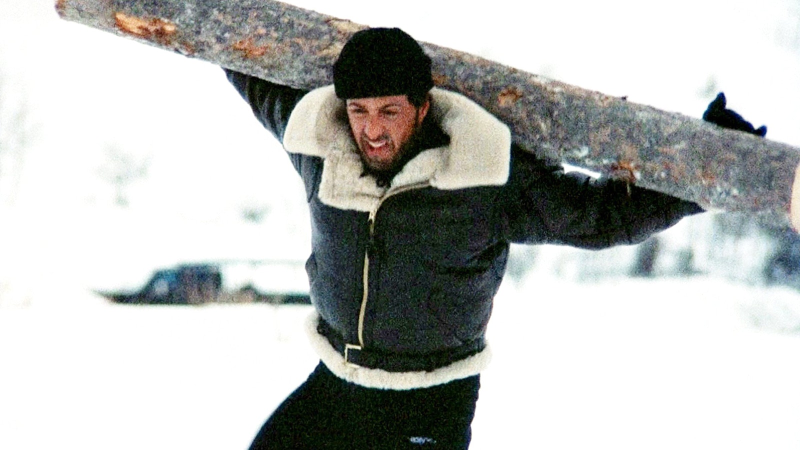 Rocky carries a heavy log through deep snow as part of his training to fight Ivan Drago in "Rocky IV."