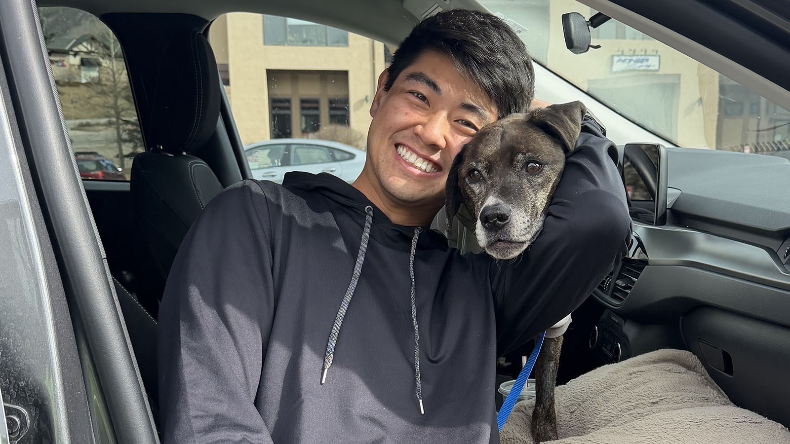 Rocky, a Labrador-boxer mix, escaped his harness during a walk near the mountain town of Montezuma, Colorado, on Dec. 28. He was rescued last week, having survived alone for 43 days in subzero nights and wolf territory. Here he's reunited with his owner, Steven Maa.