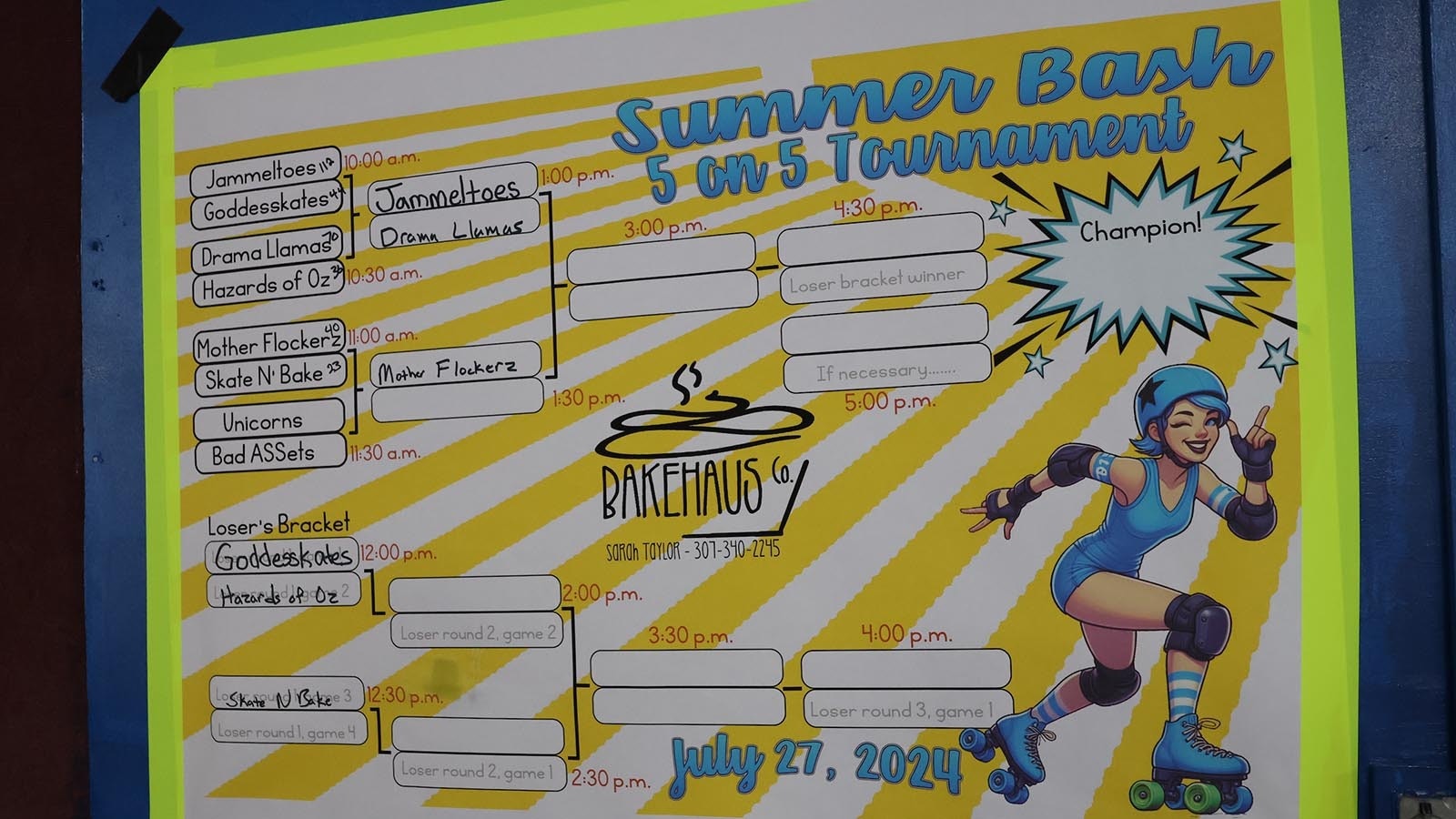 A scoreboard at the rink keeps track of team wins and loses during the tournament.