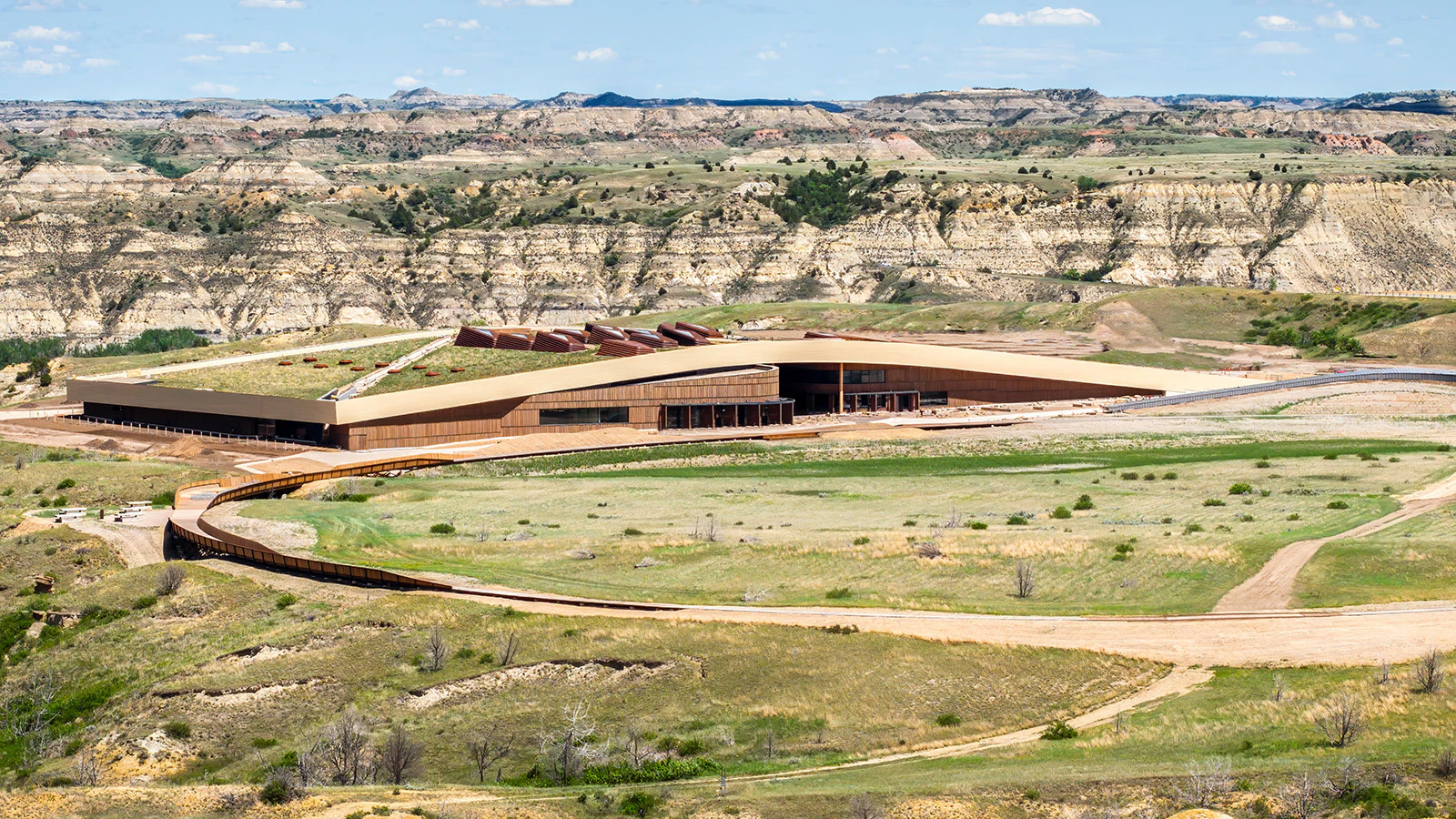 The new Theodore Roosevelt National Library in North Dakota offers a winding and interactive high-tech journey through the extraordinary life of America's 26th president. The building fits seamlessly into the prairie landscape that lured Roosevelt West.