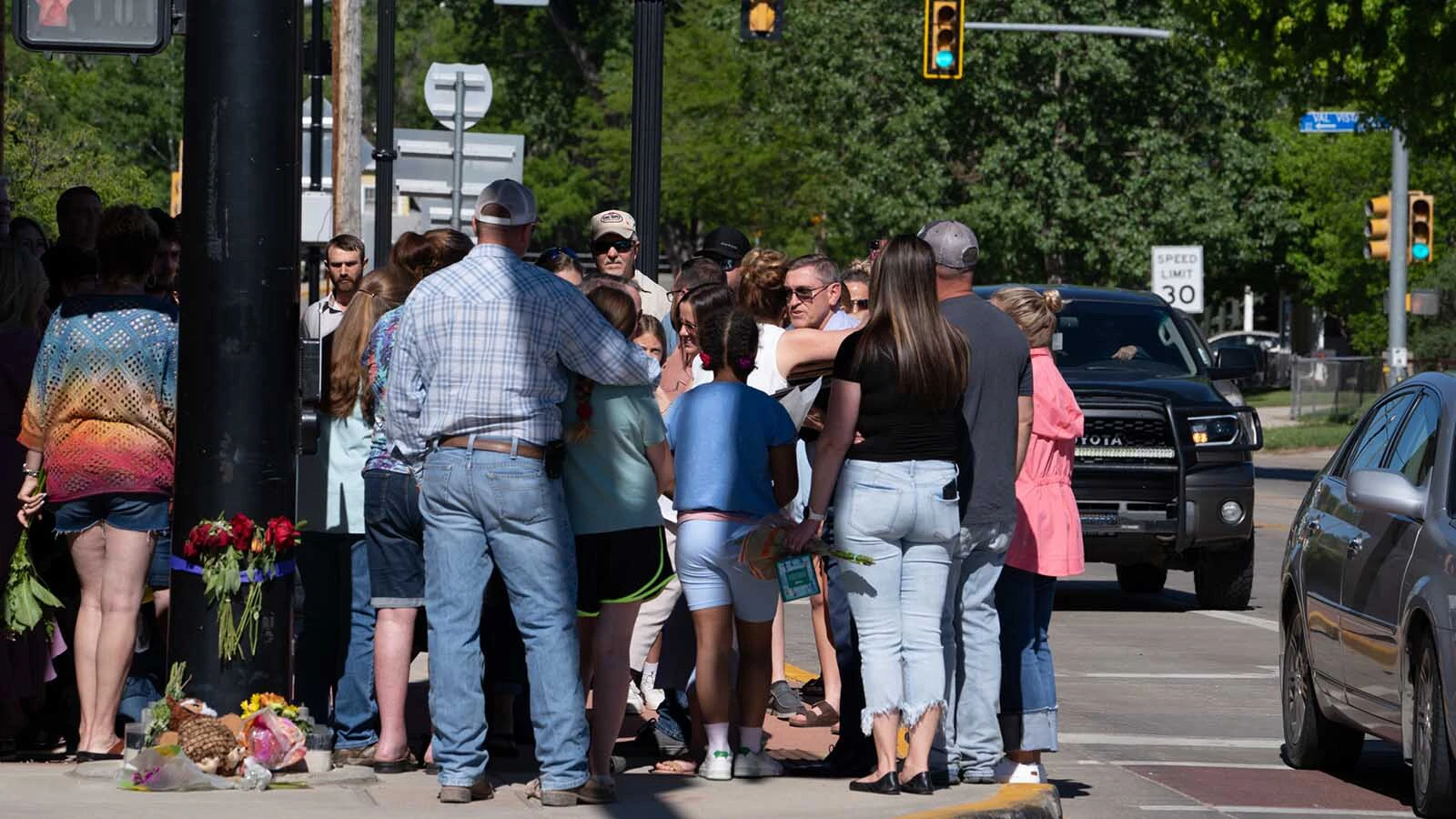 Dozens of Kate Gladdin's friends and community members held a memorial for Julie Fitzsimon's in downtown Sheridan on the corner where days earlier she was struck and killed by a distracted driver on May 28, 2025. 