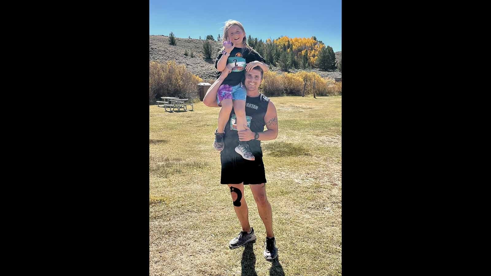 Casper native Jarod McDaniel is all smiles along with daughter Raegan following the 2024 Run the Red Desert trail run.