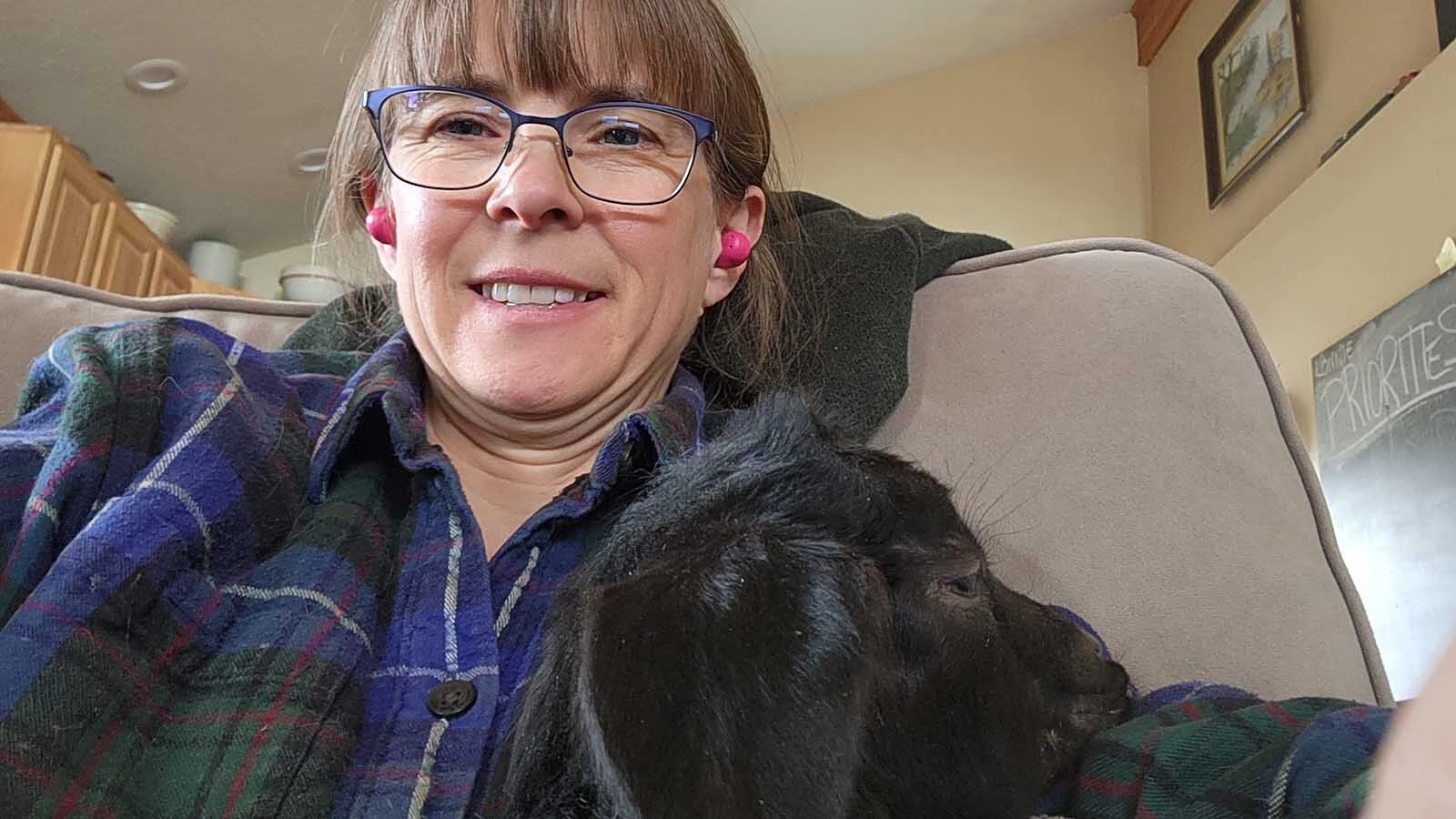 Katharne Leavitt getrs some cuddles from Tenacity.