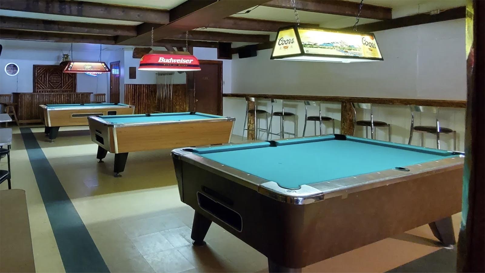 The Rustic Pine Tavern has a Dubois mandatory minimum three pool tables.