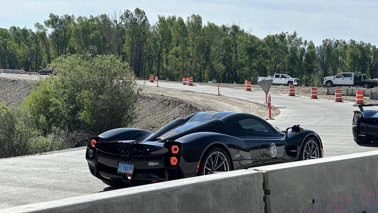One in a lineup of $4 million Pagani supercars navigating construction in Jackson, Wyoming.