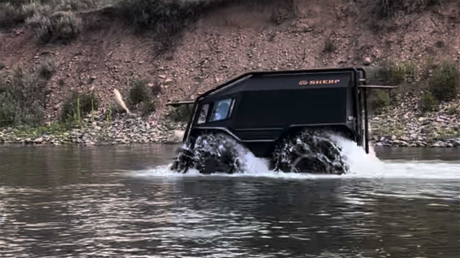 A SHERP ATV rumbles through the Blackfoot River near Missoula, Montana.