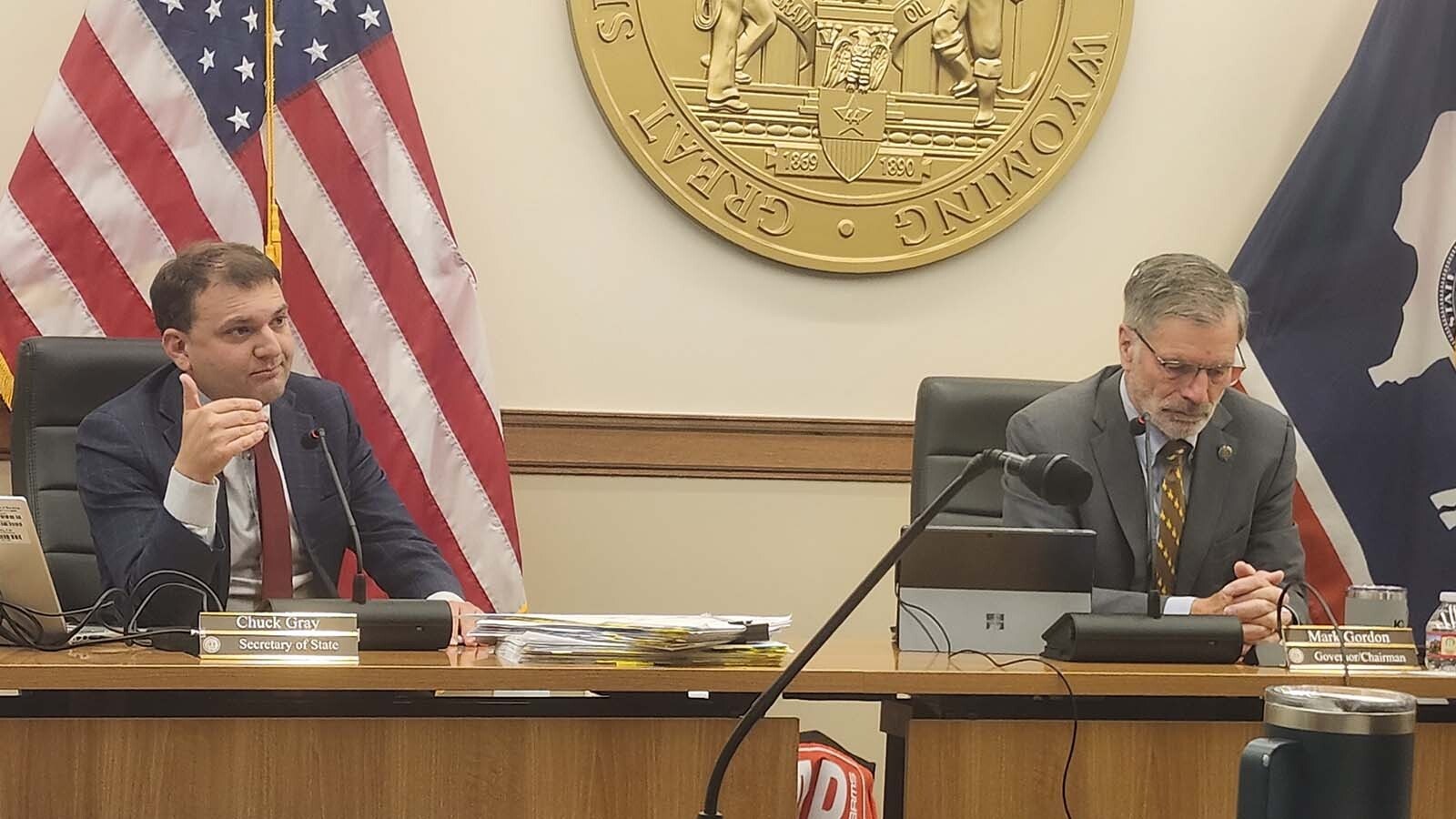 Wyoming Secretary of State Chuck Gray, left, and Gov. Mark Gordon during Thursday's meeting of the State Board of Land Commissioners.