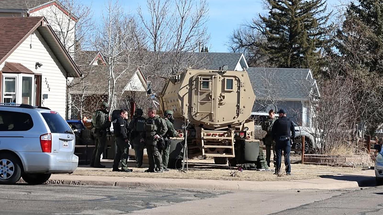 Cheyenne police used a fully armed SWAT team with an armored vehicle to breach a suspected drug house Thursday. One of two suspects arrested holed up in the home’s attic for two hours before finally giving up.