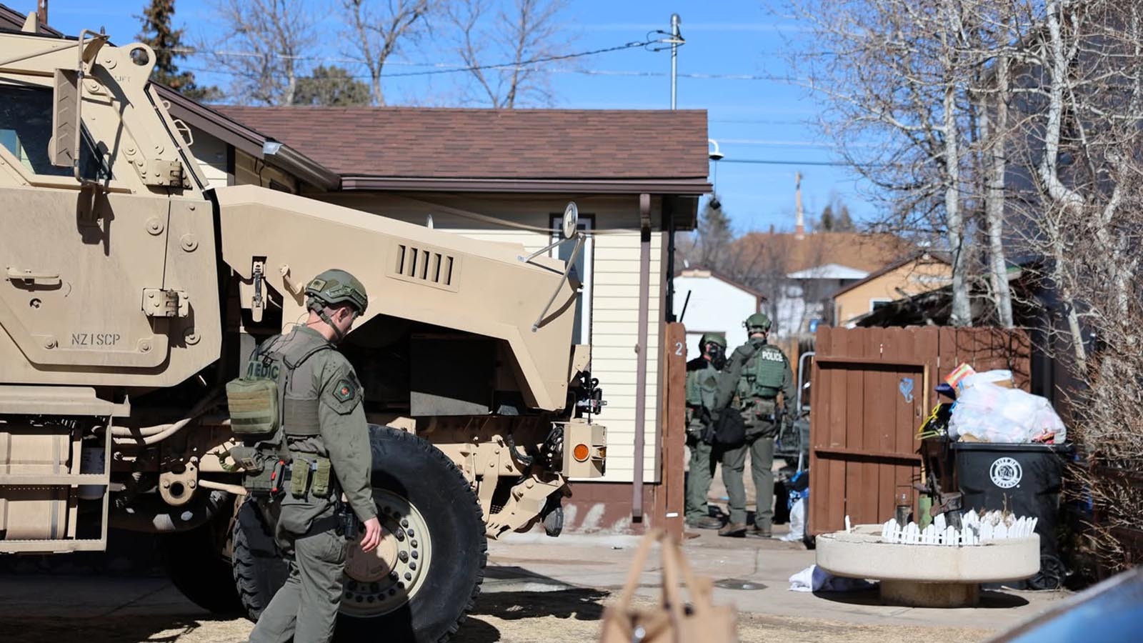 Cheyenne police used a fully armed SWAT team with an armored vehicle to breach a suspected drug house Thursday. One of two suspects arrested holed up in the home’s attic for two hours before finally giving up.