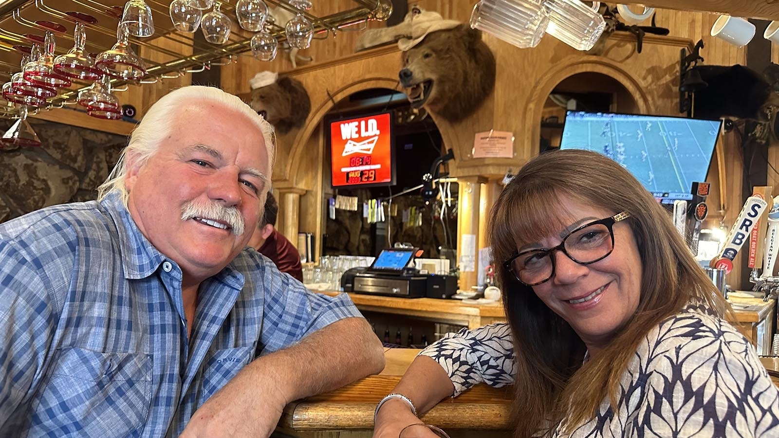 Bill and Maria Van Den Ouden pose at the Safari Club bar after taking a photo safari around the restaurant.