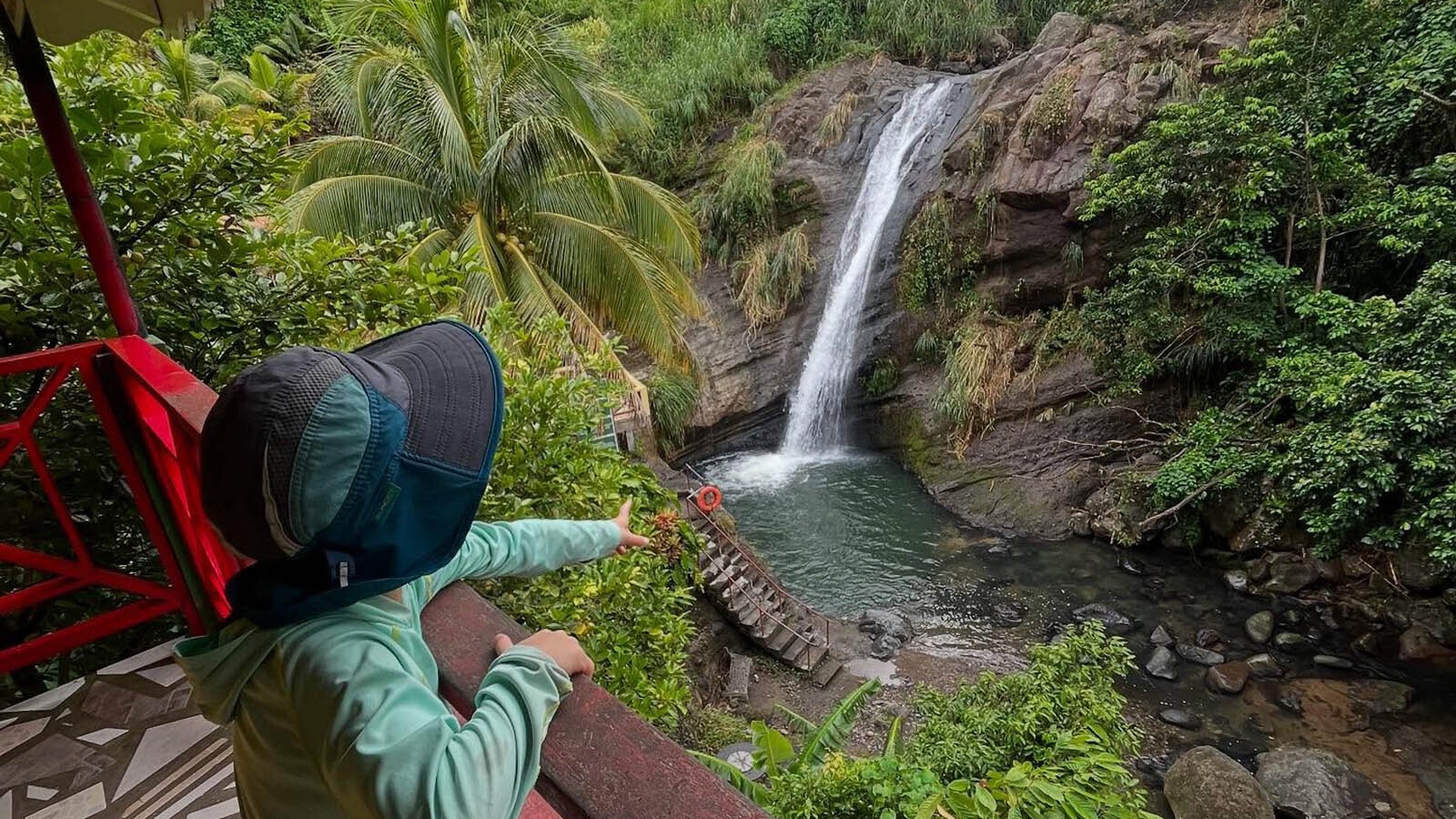 Aksel Schell, 5, points at the Concord Waterfall in Granada.