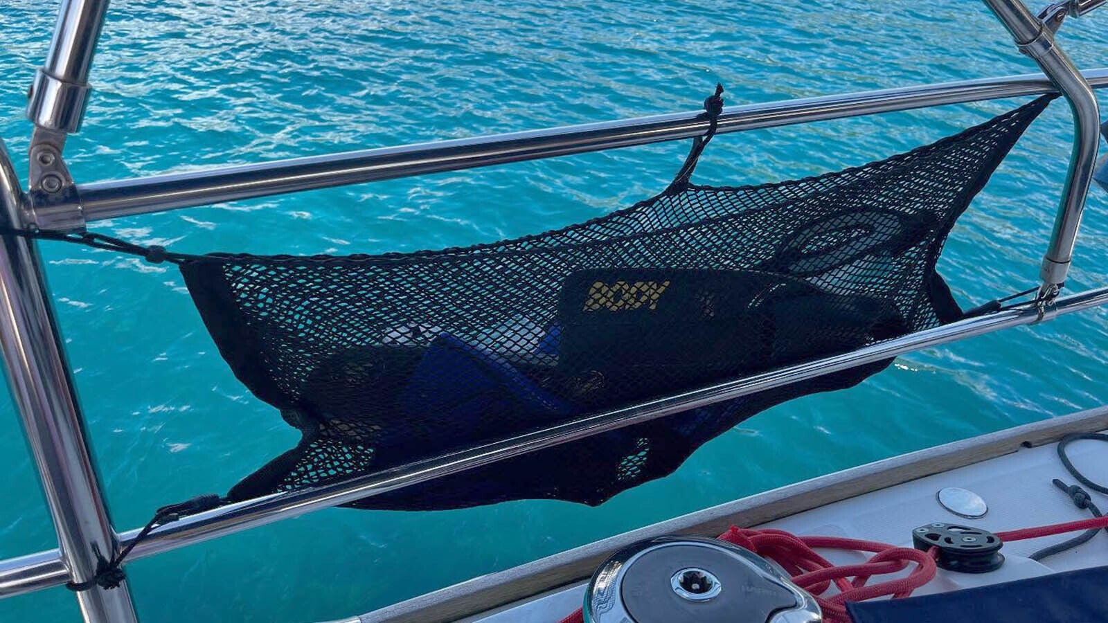 An unused luggage net became the ideal snorkel drying device aboard the Jai Meera.