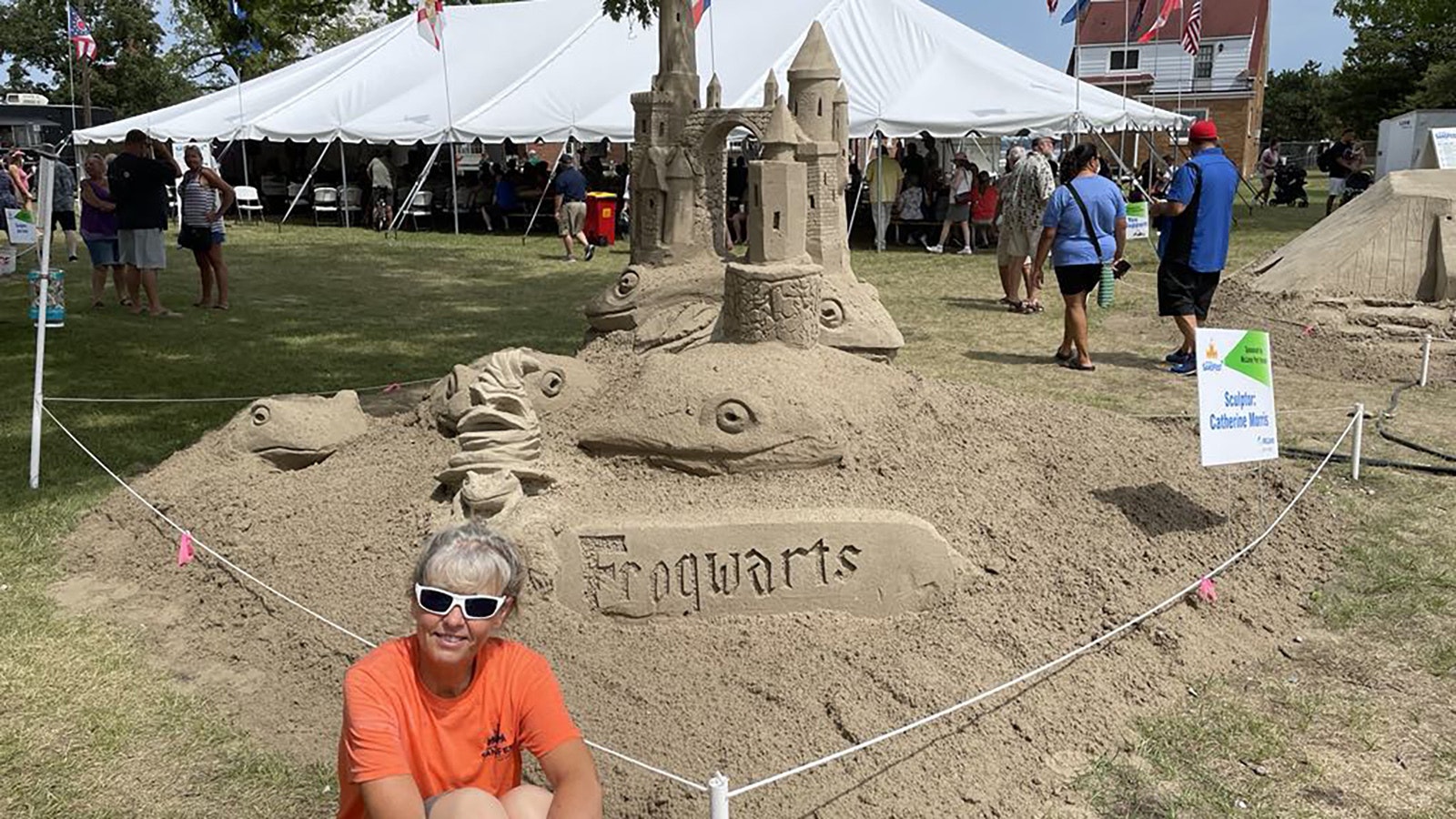 Catherine Johnson Morris poses with her Frogwarts castle, made at a Fort Horon, Michigan, sand sculpture competition, which was 9.5 feet tall and took 10 tons of sand to build.