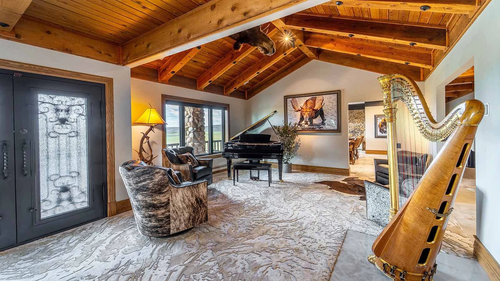 The owners are leaving all furnishings behind, including a self-playing grand piano and a harp that won't play itself.