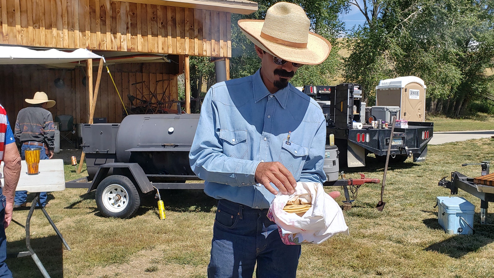 Keith Duncan offers one of his secret stash of homemade tortillas. They were delicious and perfect for wrapping around a scoop of the Savery's community pot of beans.