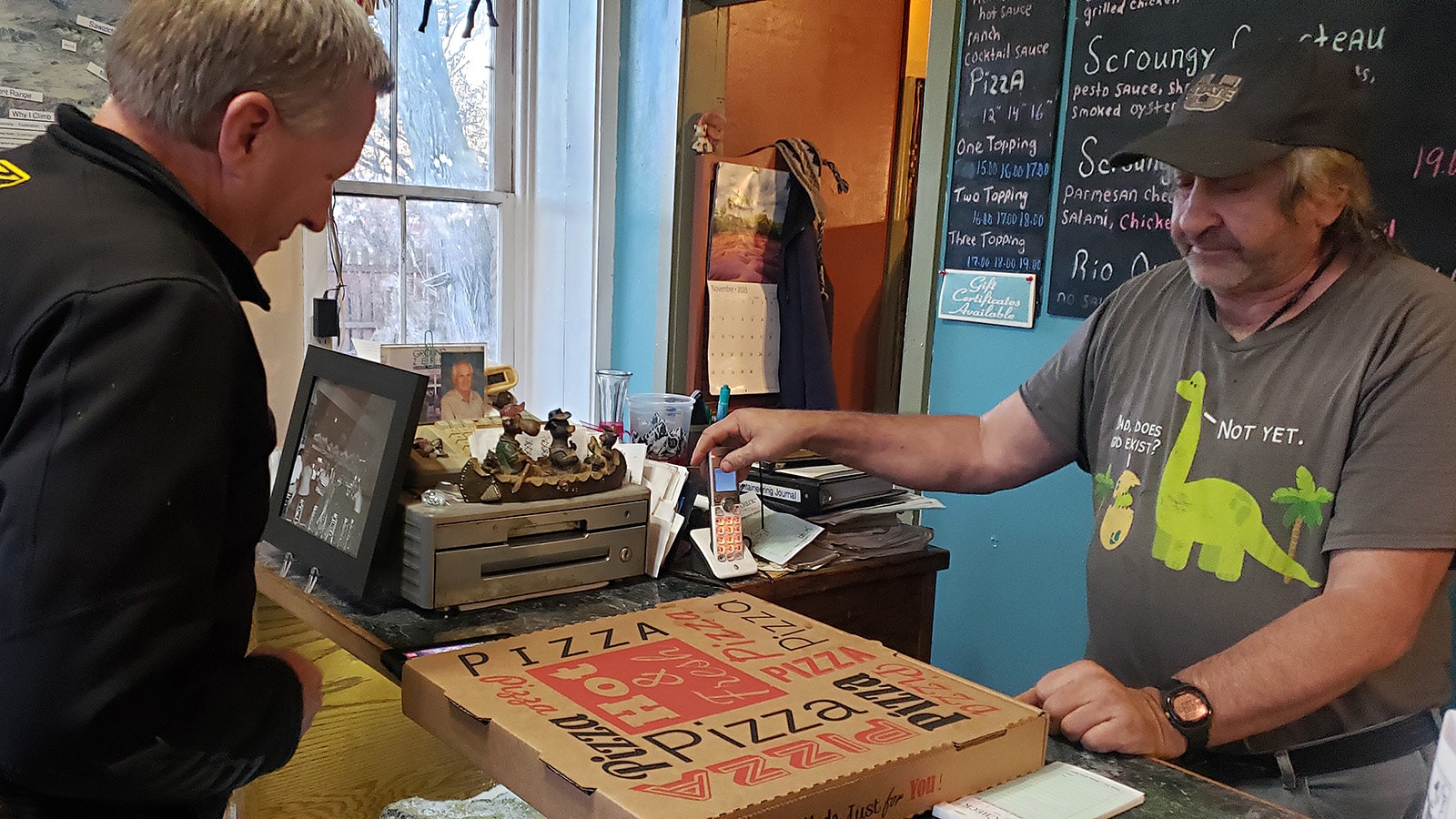 Tracy Carotta sells another creative pie from Scroungy Moose Pizza in Kemmerer.