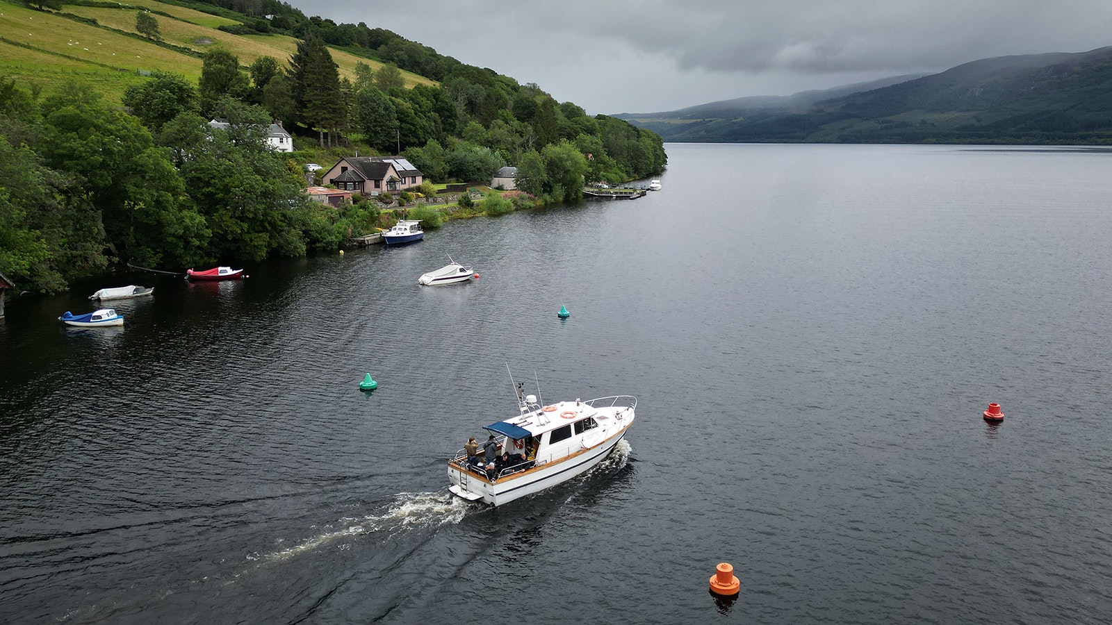 Nessie hunters board a boat on Loch Ness search for the elusive Loch Ness Monster on Aug. 27.