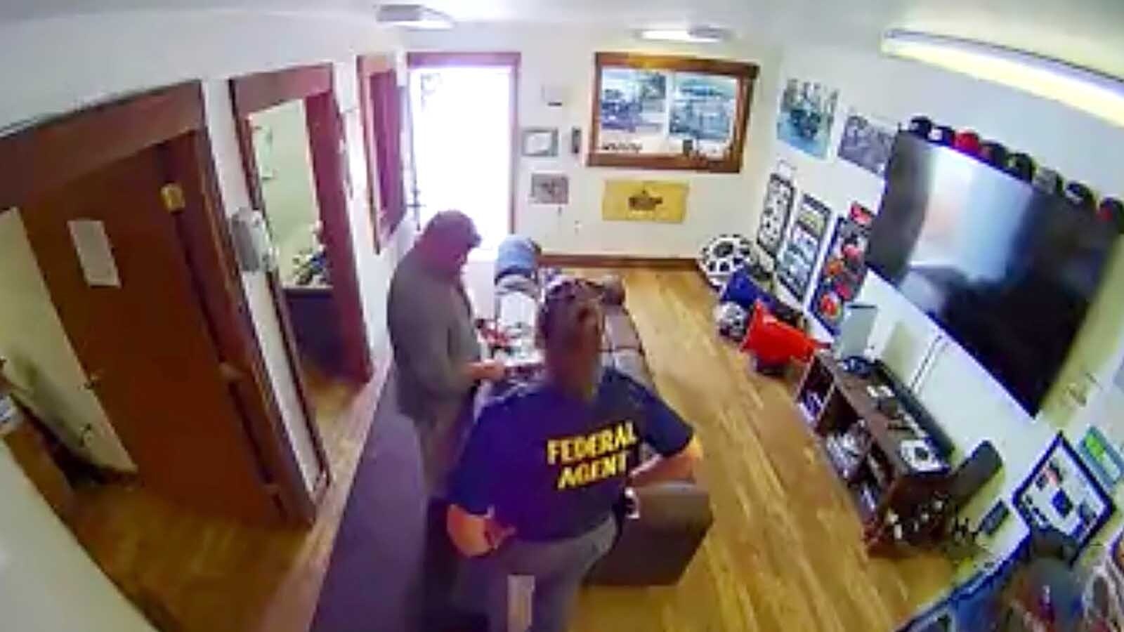 Federal agents search Levi Krech’s Gillette shop in 2022.