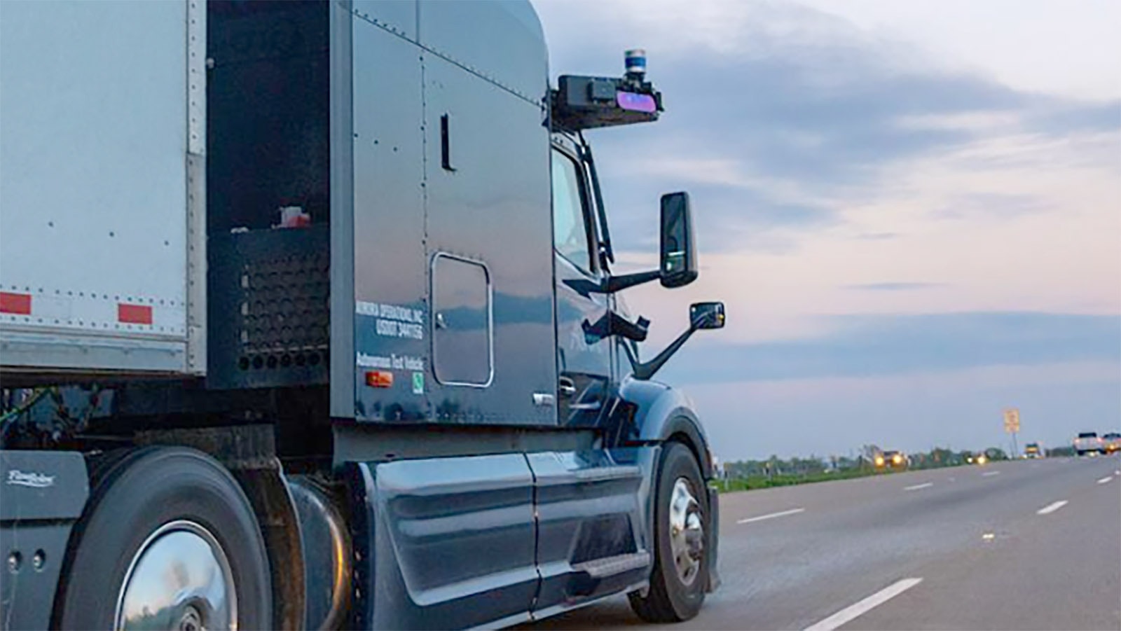 A truck with Aurora self-driving technology on the road.