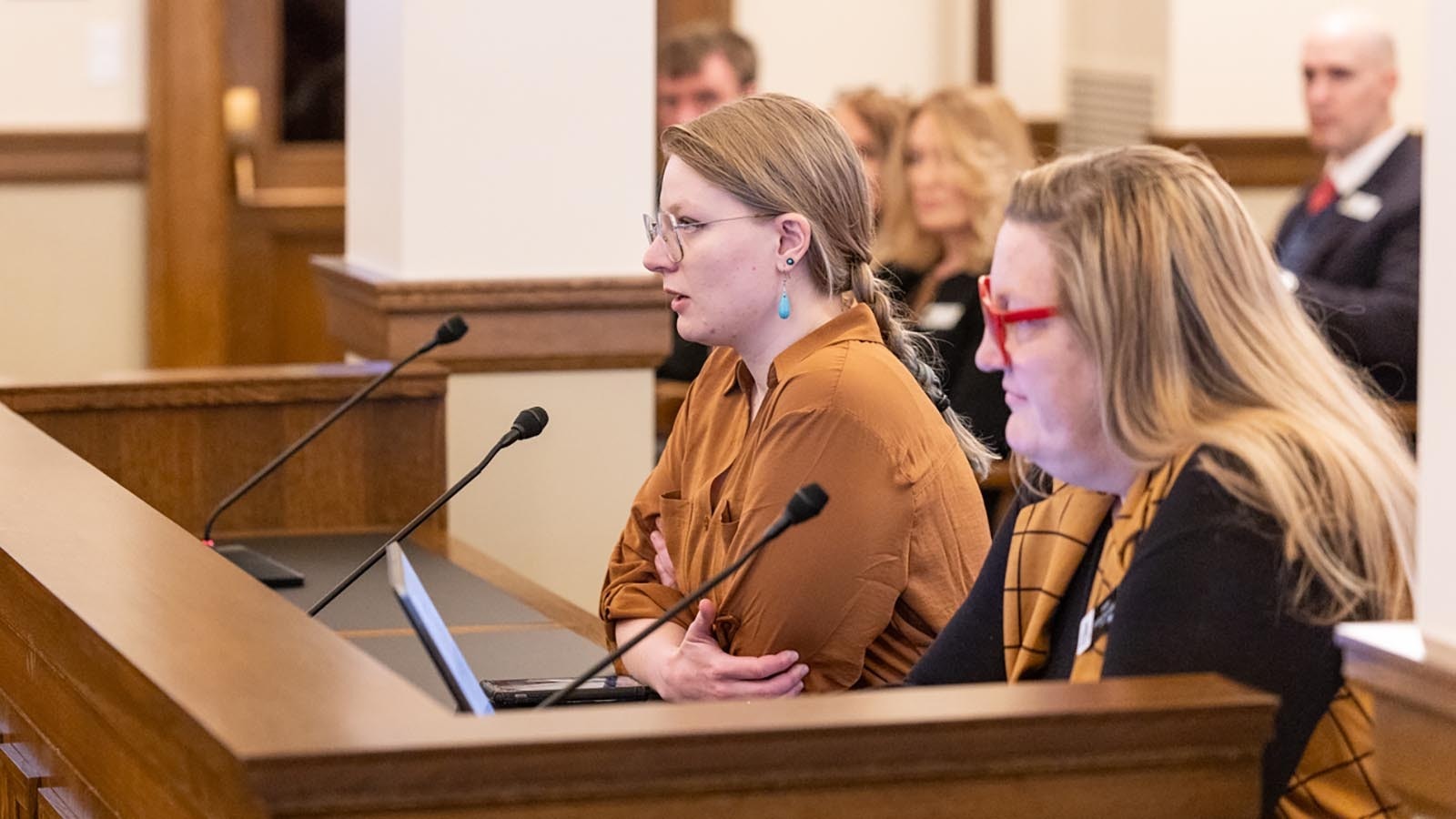 Nyoka Erikson, left, a Laramy roller derby participant, and Sara Burlingame, executive director of Wyoming Equality, testify against Senate File 44.