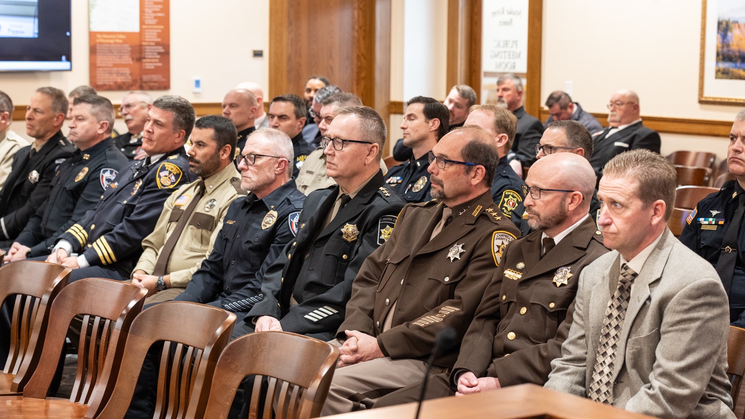 Representatives of Wyoming law enforcement agencies attend Wednesday's meeting of the House Revenue Committee at the Capitol in Cheyenne on Feb. 25, 2026.
