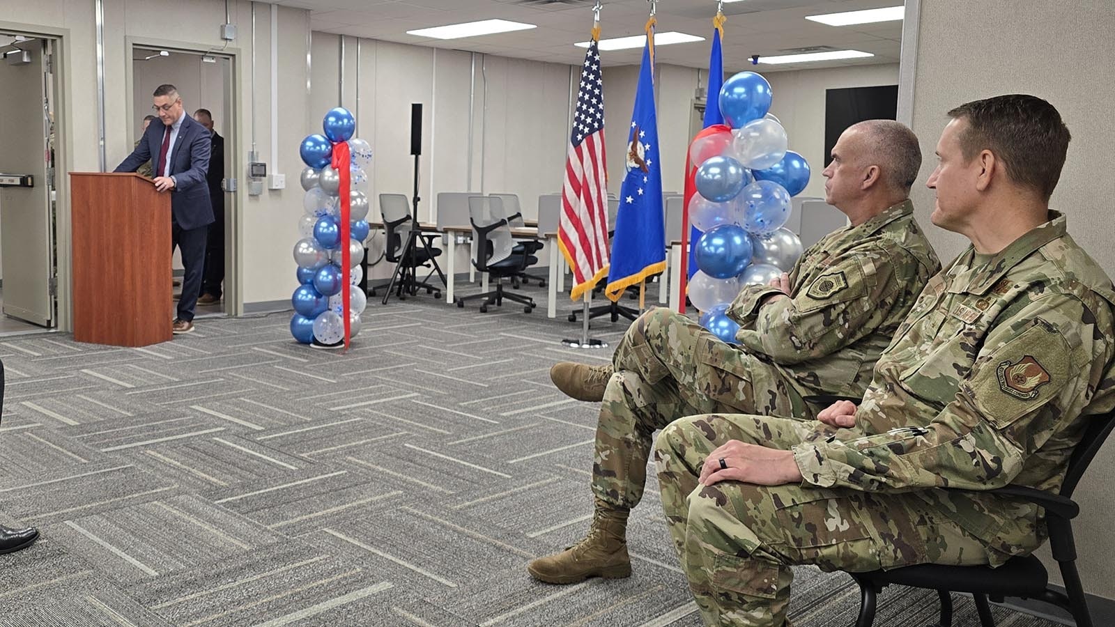 Brig. Gen. William Rogers and Maj. Gen. Colin Connor, far right, listen as they are introduced during a ceremony celebrating the opening of the Site Activation Task Force headquarters.