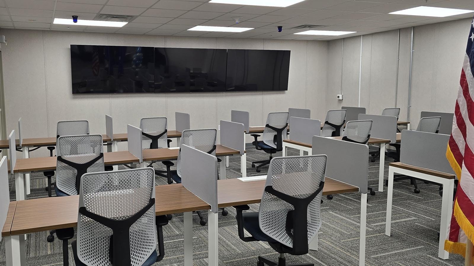 The "Large Conference Room" may have hosted dignitaries with cell phones on Wednesday. But soon, cell phones won't even be allowed in this area, which is the first tier of a cone of silence that's been built at the Site Activation Headquarters. On the back wall is a monitor where the Sentinel construction can be monitored remotely around the clock.
